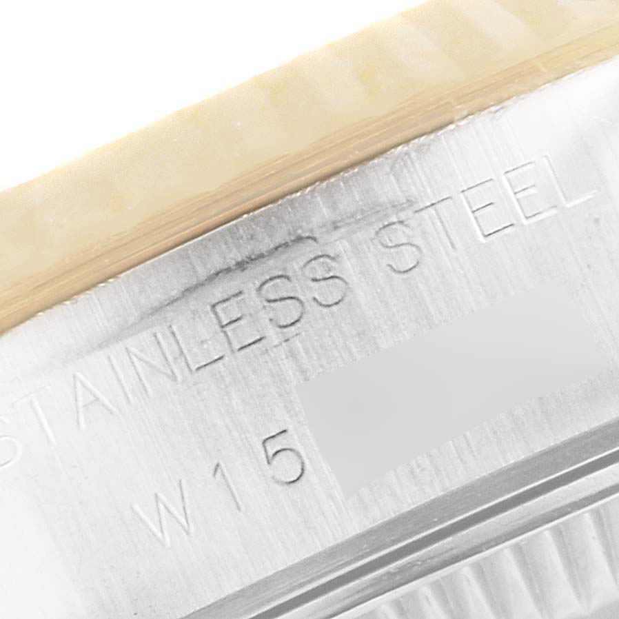 This close-up image shows part of the stainless steel casing with an inscription on the Rolex Datejust 69173 Women
s Steel and Gold (two tone) Champagne Dial 69173 Women
s Steel and Gold (two tone) Champagne Dial watch.