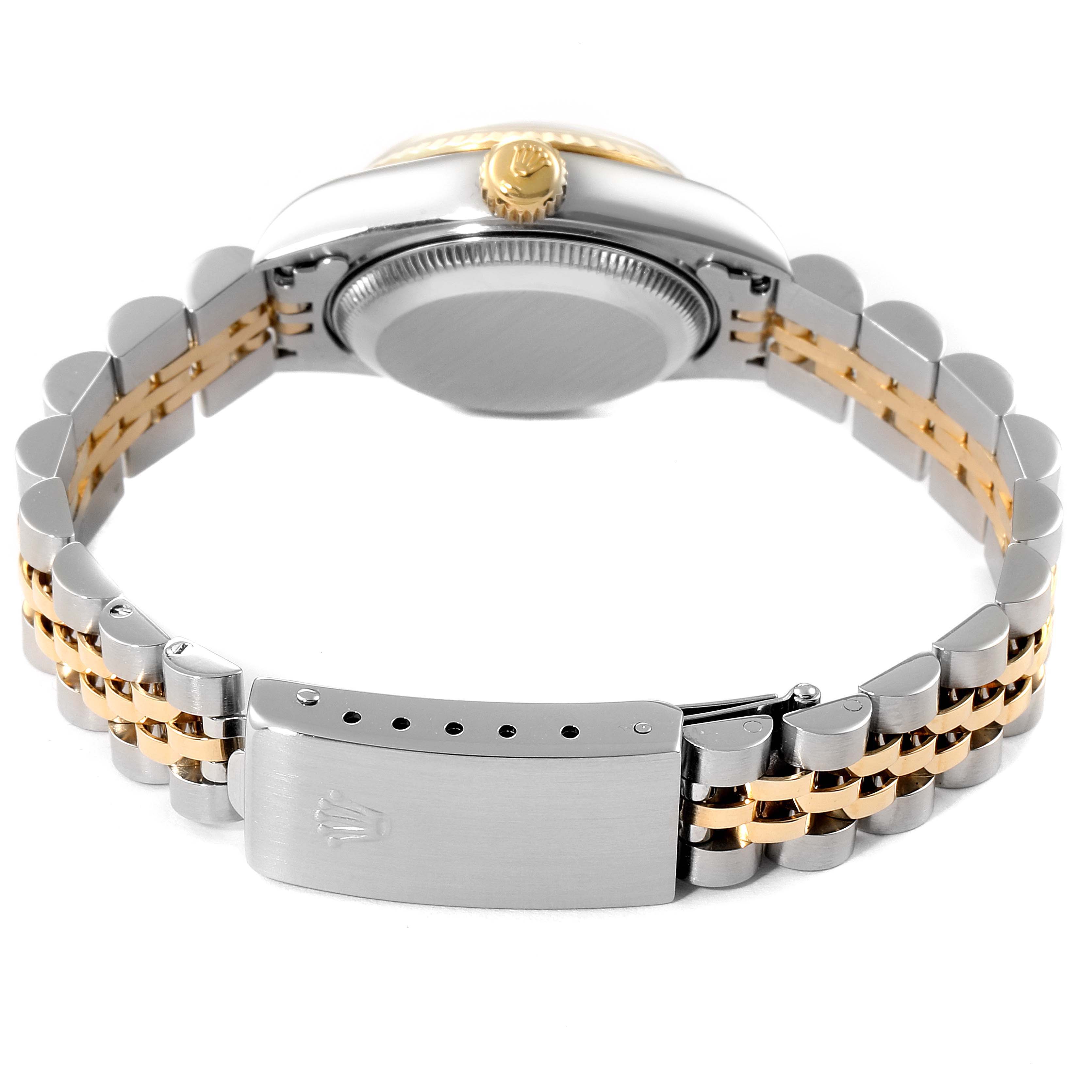 The image shows the back view of a Rolex Datejust 69173 Women
s Steel and Gold (two tone) Champagne Dial 69173 Women
s Steel and Gold (two tone) Champagne Dial watch, highlighting the case back and the bracelet
s clasp.