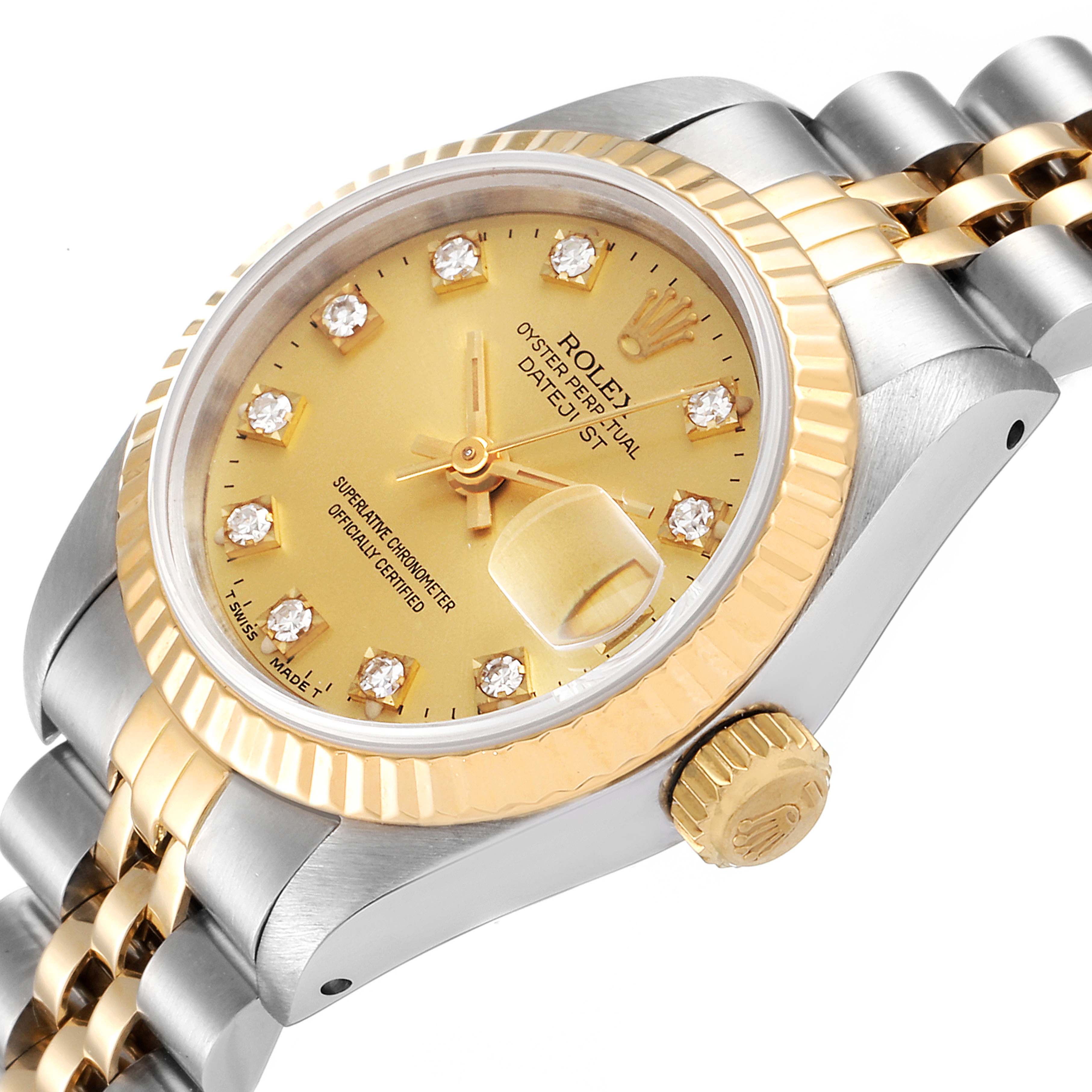 The image shows a close-up angled view of the Rolex Datejust 69173 Women
s Steel and Gold (two tone) Champagne Dial 69173 Women
s Steel and Gold (two tone) Champagne Dial watch, highlighting the gold dial, diamond hour markers, and Jubilee bracelet.