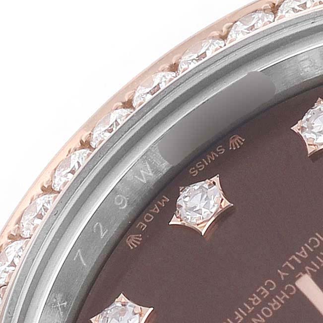 The image shows a close-up of the Rolex Datejust 279381 Women's Stainless Steel Brown Dial dial and diamond-studded bezel at an angle.