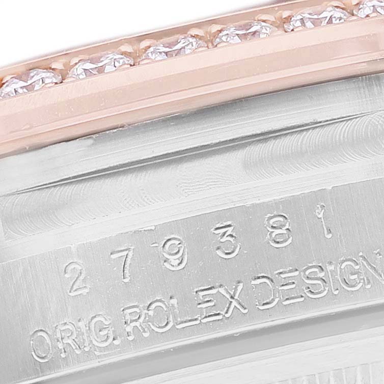 The image shows a close-up of the side of a Rolex Datejust 279381 Women's Stainless Steel Brown Dial, focusing on the bezel and engraved case details.