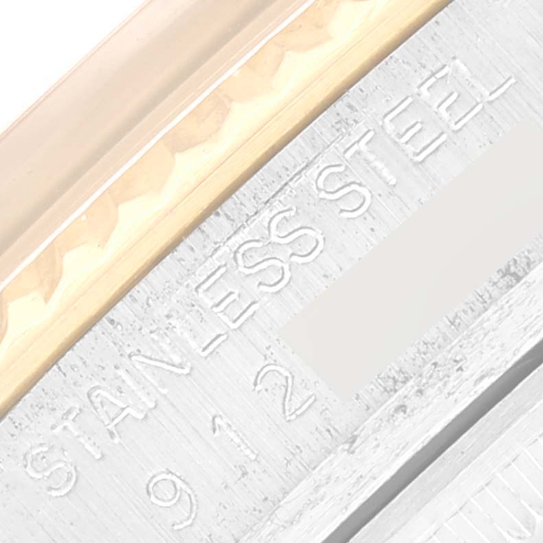 This image shows a close-up of the case side of a Rolex Vintage Collection 16013 Men's Steel and Gold (two tone) Champagne Dial 16013 Men's Steel and Gold (two tone) Champagne Dial watch, with "STAINLESS STEEL" engraved.