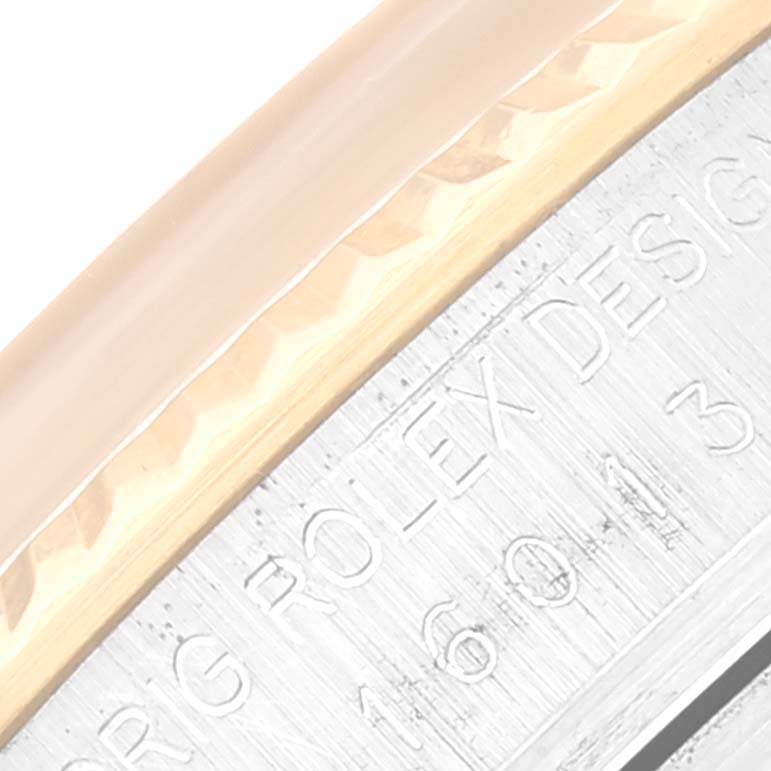 This close-up image shows the bezel and engraved edge of a Rolex Vintage Collection 16013 Men's Steel and Gold (two tone) Champagne Dial 16013 Men's Steel and Gold (two tone) Champagne Dial watch, focusing on the text.