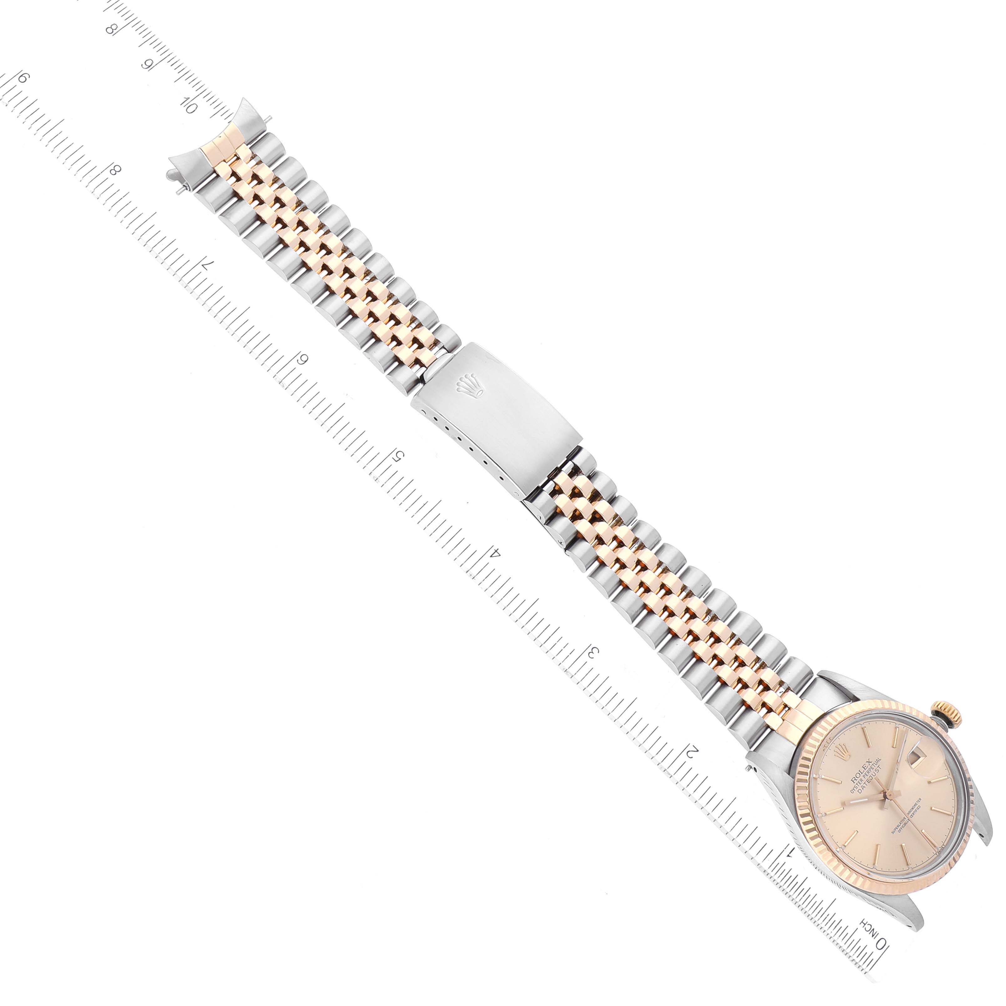 This image shows a Rolex Vintage Collection 16013 Men's Steel and Gold (two tone) Champagne Dial 16013 Men's Steel and Gold (two tone) Champagne Dial watch laid flat, displaying its face, crown, and two-tone metal bracelet with a clasp.