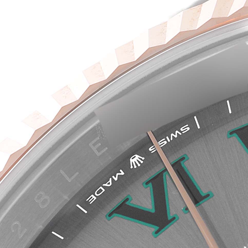 This image shows a close-up of the dial, bezel, and the "Swiss Made" text on the Rolex Datejust 41 126331 Men's Steel and Gold (two tone) Grey Dial 126331 Men's Steel and Gold (two tone) Grey Dial model.