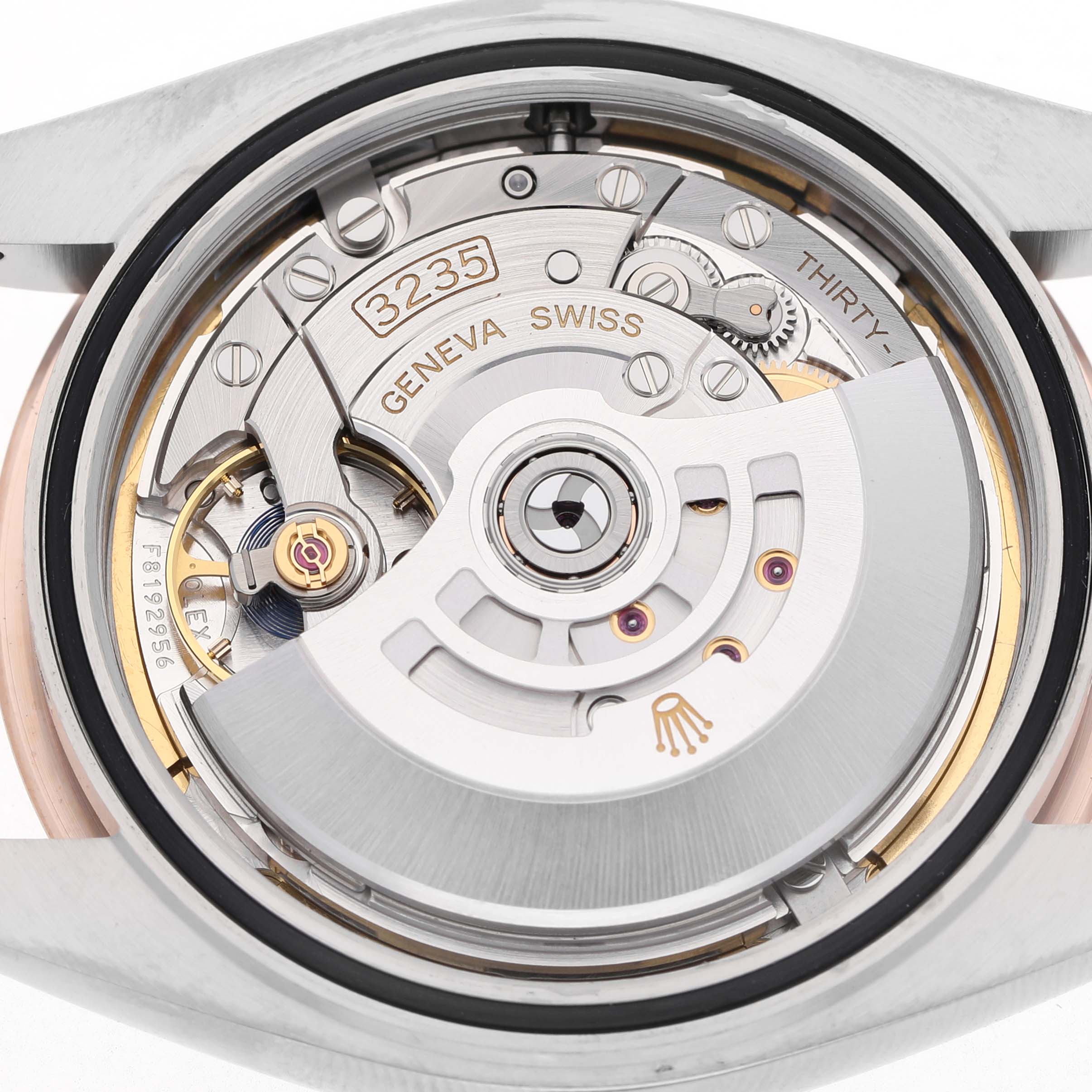 The image shows the movement of a Rolex Datejust 41 126331 Men's Steel and Gold (two tone) Brown Dial watch from the back, highlighting the intricate mechanisms and rotor.