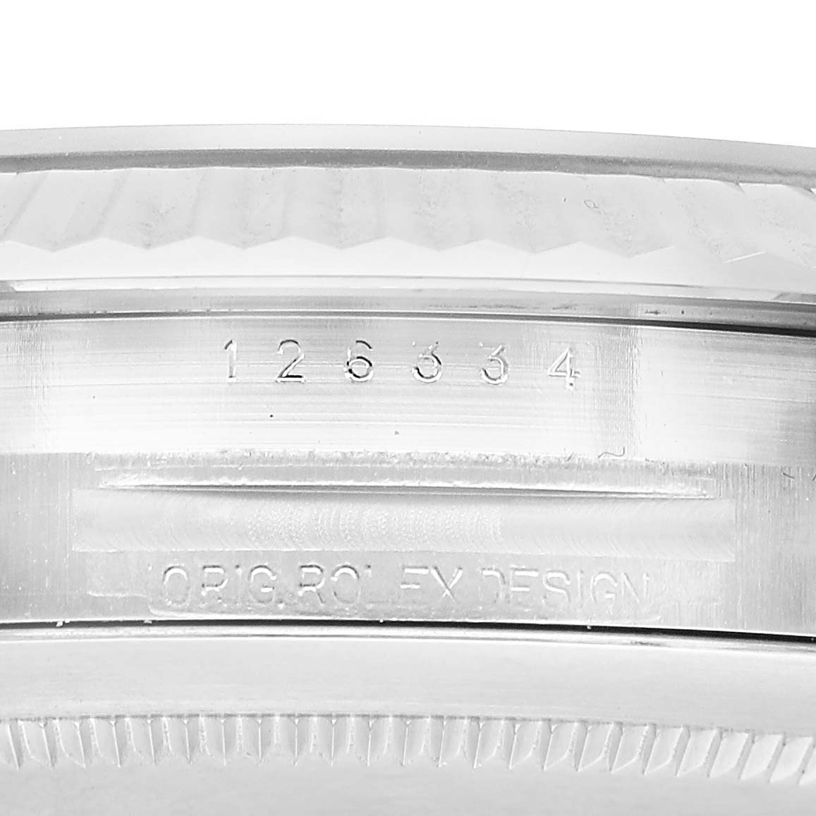 The image shows the side of a Rolex Datejust 41 126334 Men's Stainless Steel Blue Dial watch case, featuring engraved serial numbers and design markings.