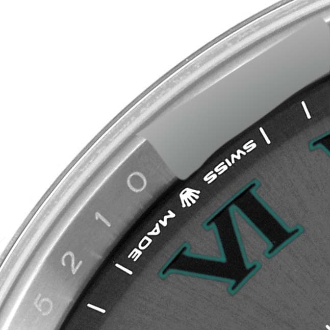 This close-up angle of the Rolex Datejust 41 126334 Men's Stainless Steel Grey Dial 126334 Men's Stainless Steel Grey Dial displays part of the dial, the number VI, and the "SWISS MADE" inscription.