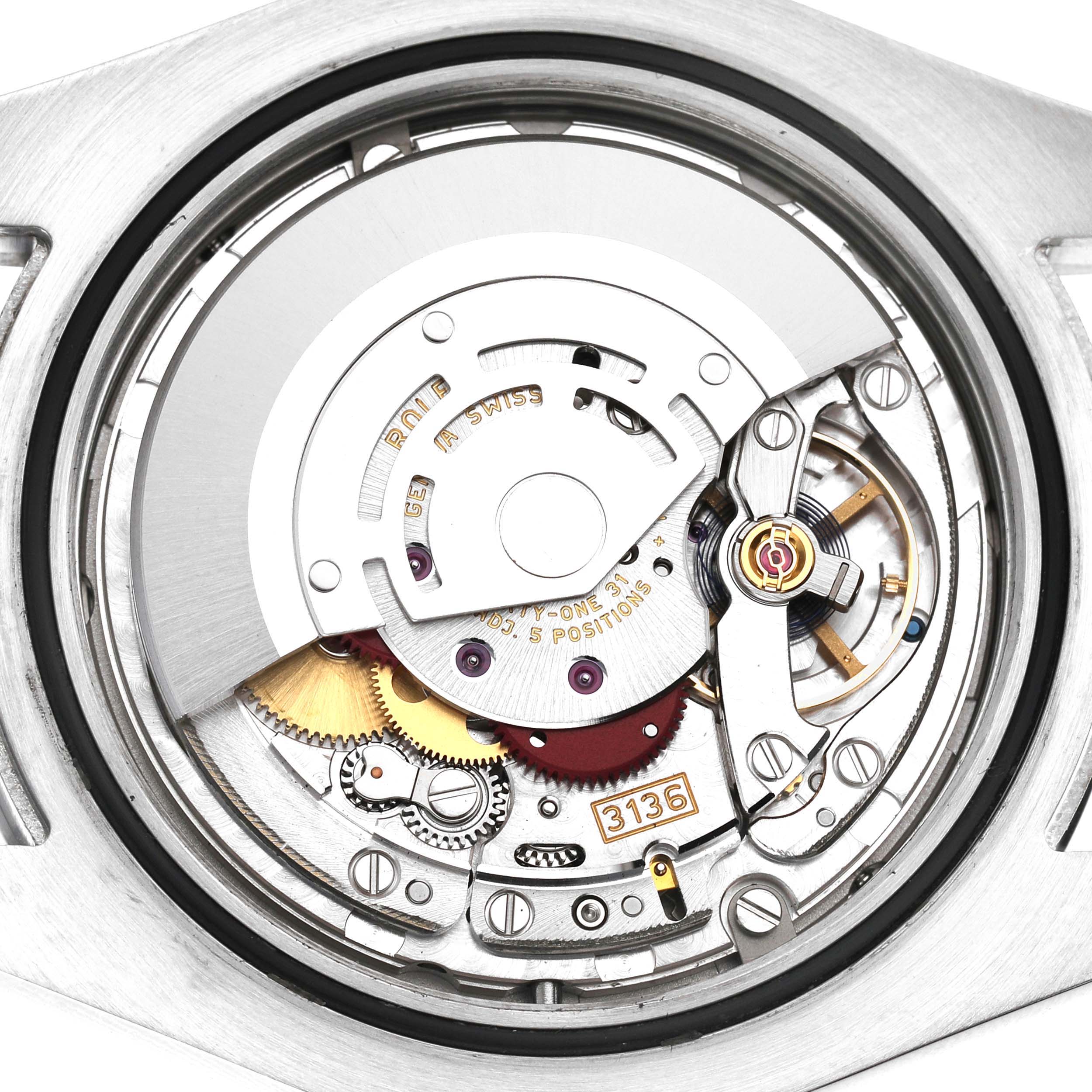 The image shows the movement of a Rolex Datejust 41 116300 Men's Stainless Steel White Dial from the back, highlighting its intricate mechanical parts.