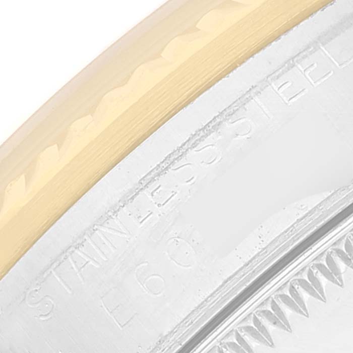 The image shows a close-up of the bezel and outer edge of the case back of a Rolex Mid-Size 68273 Women's Steel and Gold (two tone) Silver Dial 68273 Women's Steel and Gold (two tone) Silver Dial watch, highlighting its stainless steel material.