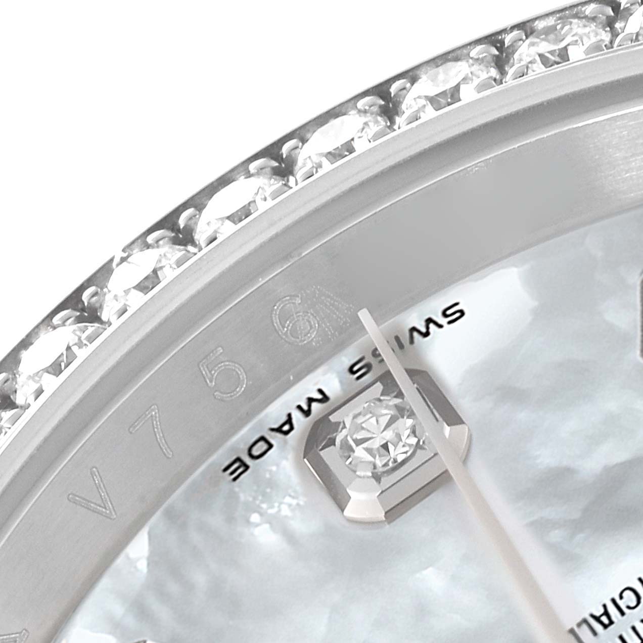This close-up image of a Rolex Datejust 116244 Men's Stainless Steel Mother of Pearl Dial 116244 Men's Stainless Steel Mother of Pearl Dial watch showcases part of the dial, the "Swiss Made" mark, and a diamond-set bezel.