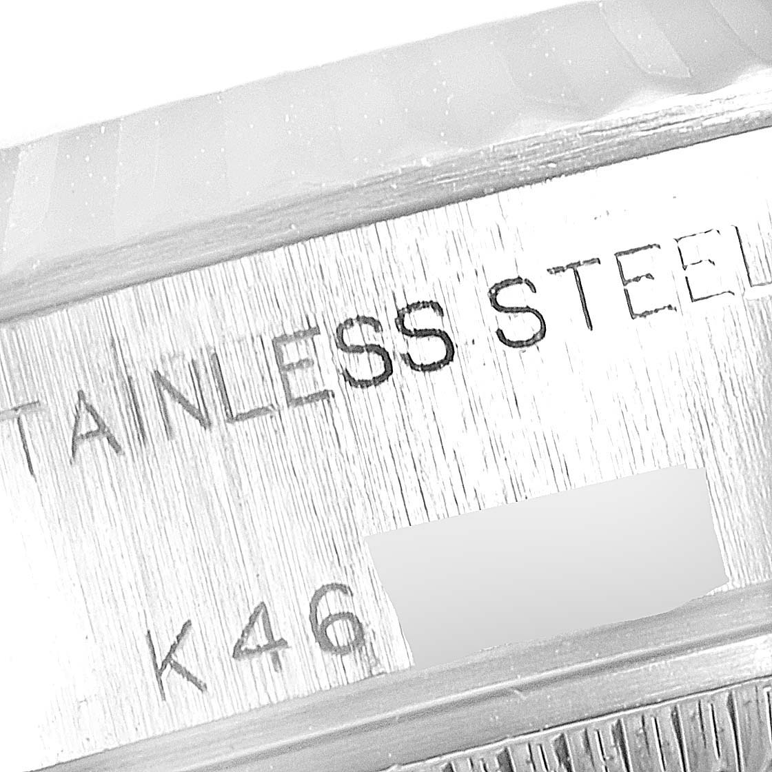 The image shows a close-up of the stainless steel inscription on the side case of a Rolex Datejust 79174 Women
s Stainless Steel Mother of Pearl Dial 79174 Women
s Stainless Steel Mother of Pearl Dial watch.