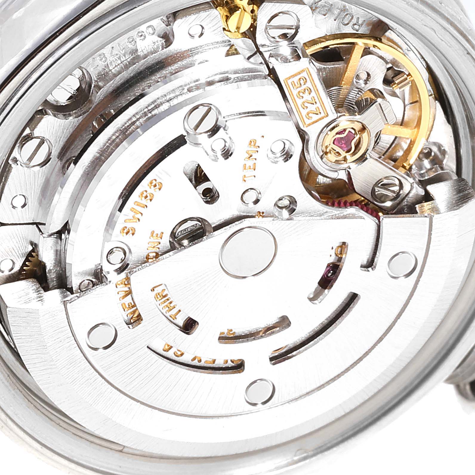 The image shows a close-up of the Rolex Datejust 79174 Women
s Stainless Steel Mother of Pearl Dial 79174 Women
s Stainless Steel Mother of Pearl Dial watch
s movement from the back angle, displaying its intricate mechanical components.