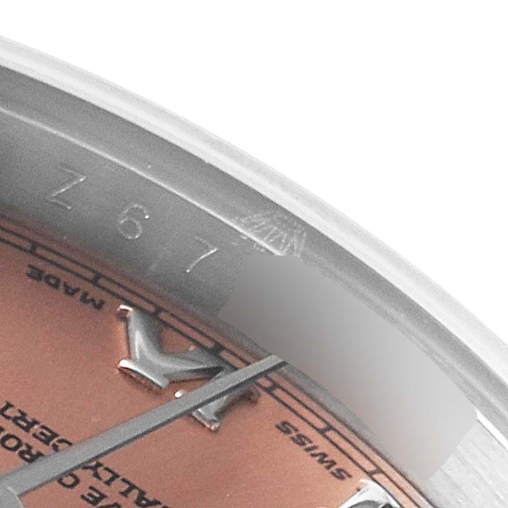 This close-up angle shows part of the dial and indices of a Rolex Datejust 179160 Women's Stainless Steel Pink Dial 179160 Women's Stainless Steel Pink Dial watch.