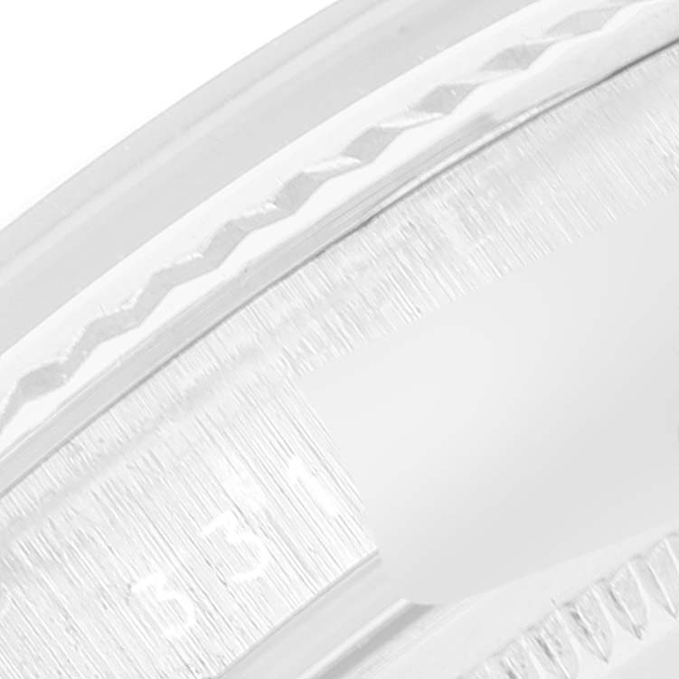 The image shows a close-up of the bezel and part of the date display of a Rolex Datejust 1601 Men
s Stainless Steel Black Dial 1601 Men
s Stainless Steel Black Dial watch.