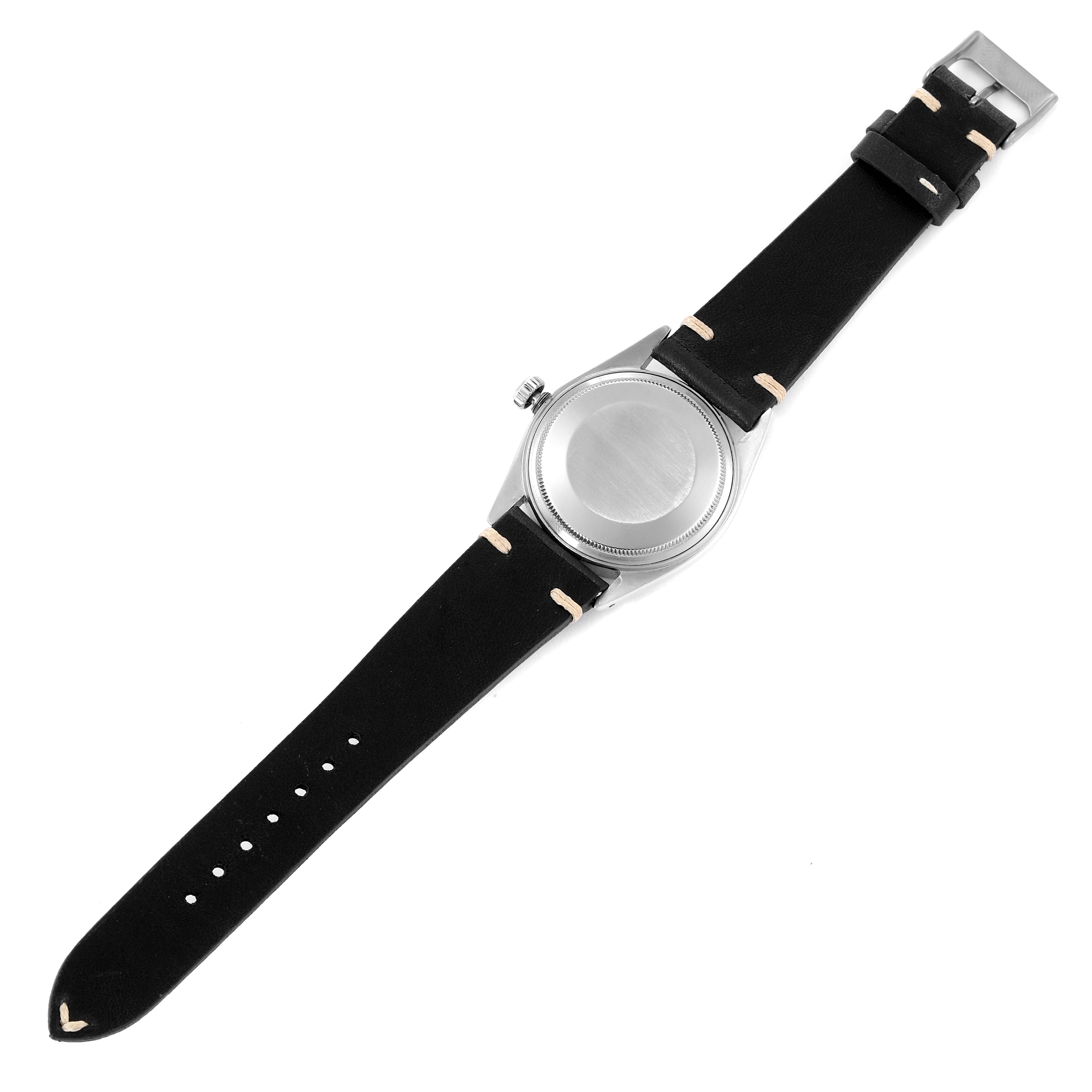 The image shows the back case and full strap of a Rolex Datejust 1601 Men
s Stainless Steel Black Dial 1601 Men
s Stainless Steel Black Dial watch from a top-down angle.