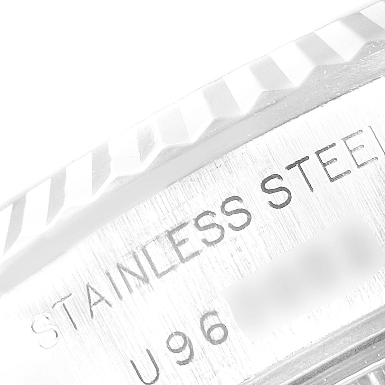 The image shows a close-up of the stainless steel case and fluted bezel of a Rolex Datejust 69174 Women
s Stainless Steel Silver Dial 69174 Women
s Stainless Steel Silver Dial watch.