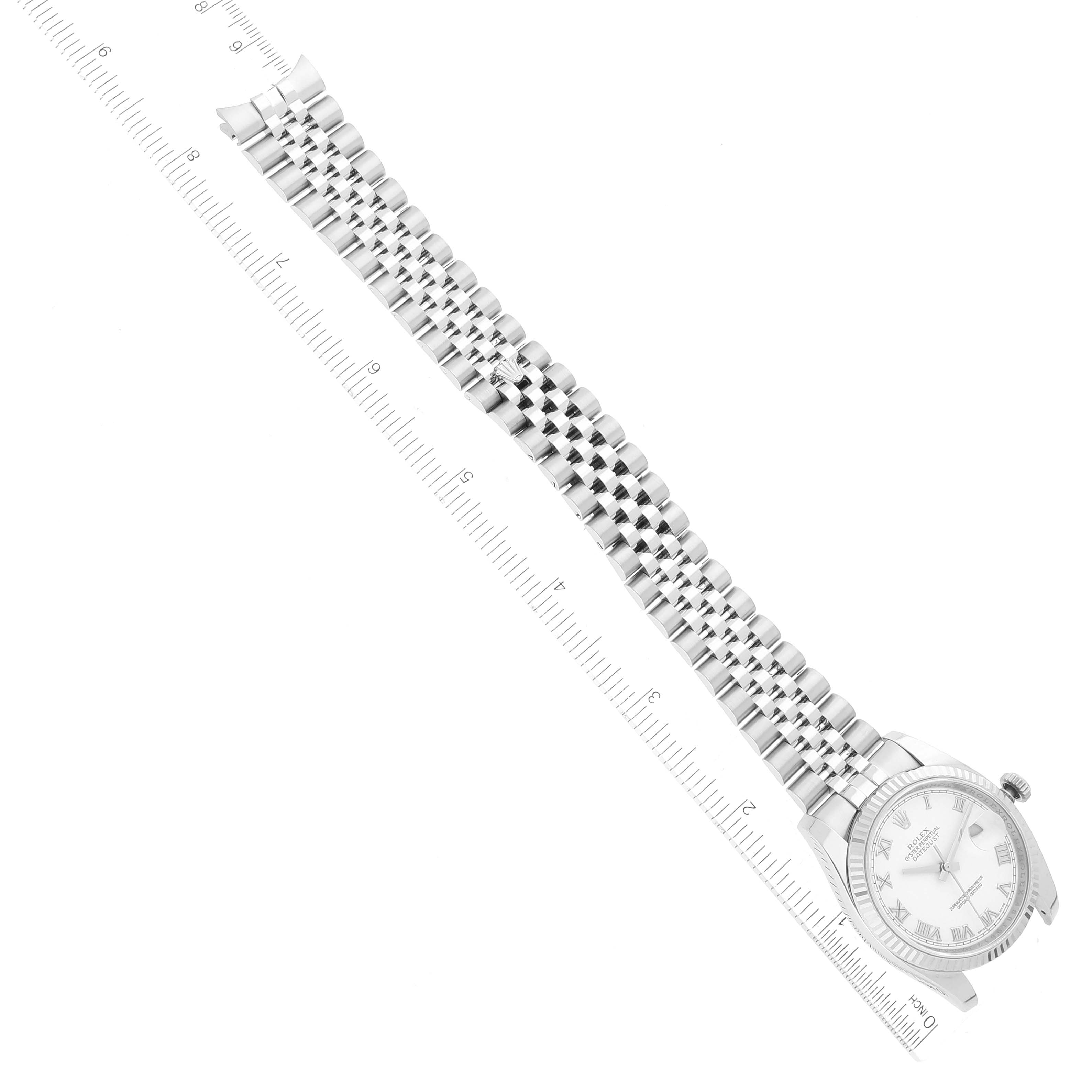 The image shows a Rolex Datejust 116234 Men's Stainless Steel White Dial 116234 Men's Stainless Steel White Dial watch laid flat with a ruler alongside, highlighting the face and the full length of its metal bracelet.