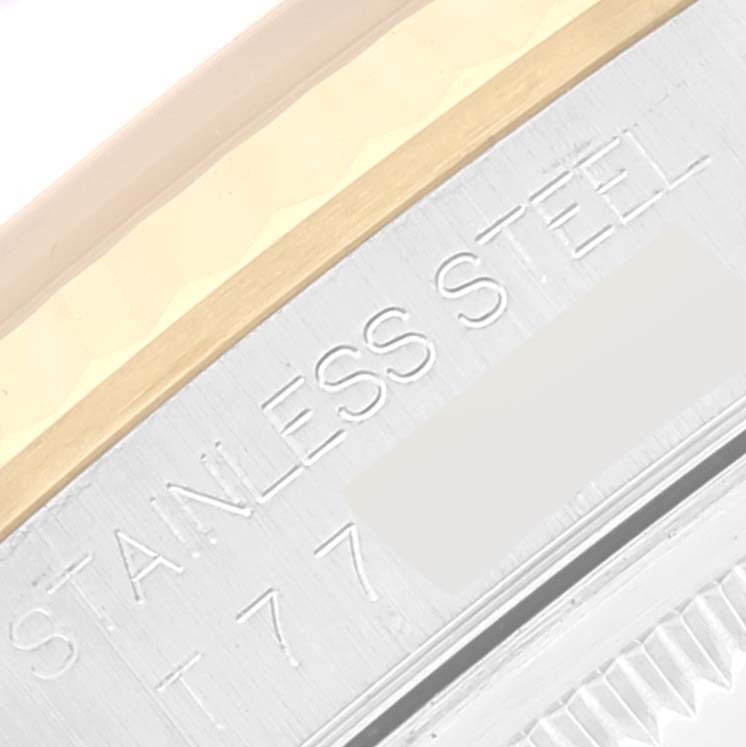 The image shows a close-up angle of the case edge of the Rolex Datejust 16233 Men's Steel and Gold (two tone) Champagne Dial 16233 Men's Steel and Gold (two tone) Champagne Dial watch, highlighting the "STAINLESS STEEL" engraving.