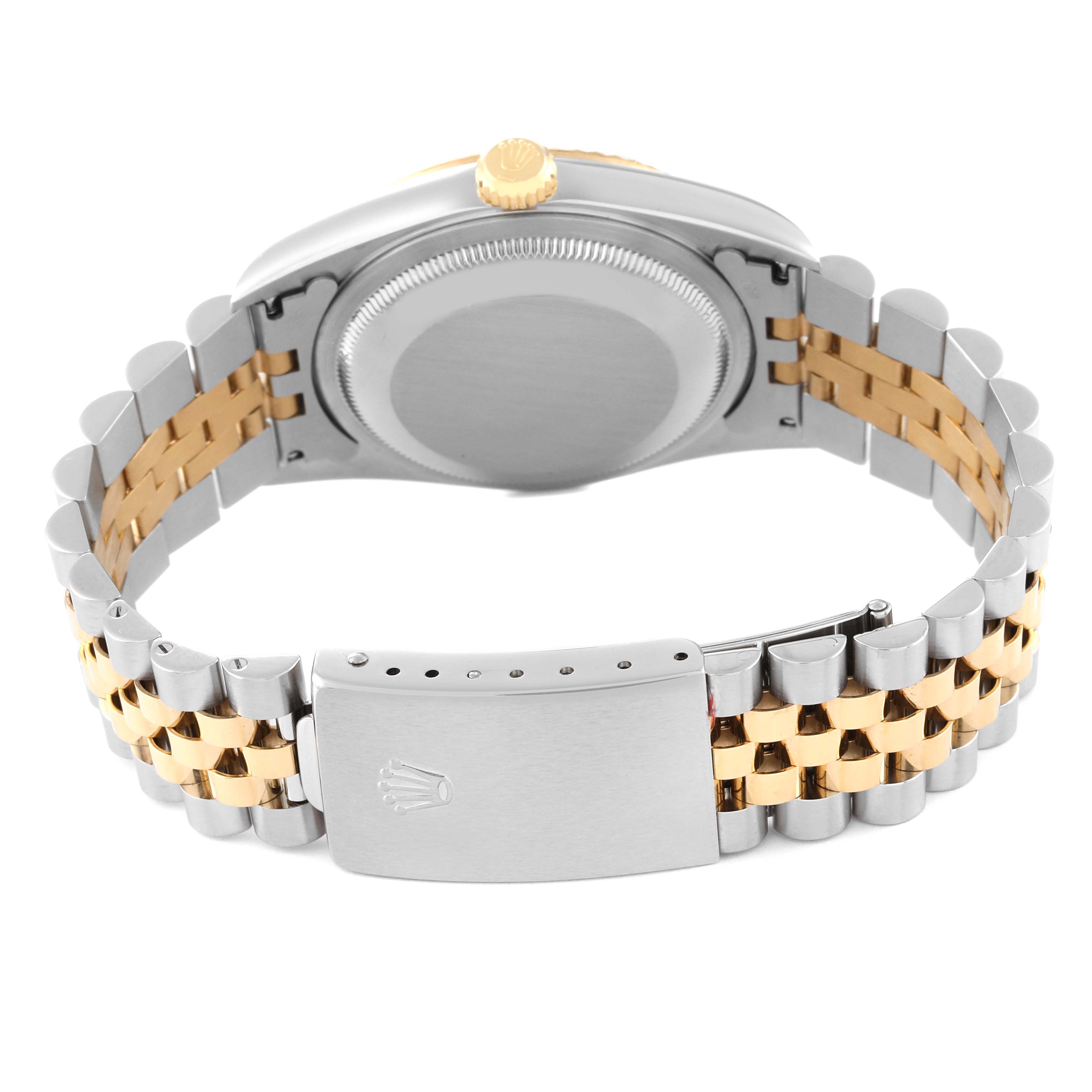 The image shows the back of a Rolex Datejust 16233 Men's Steel and Gold (two tone) Champagne Dial 16233 Men's Steel and Gold (two tone) Champagne Dial watch, displaying its case back, crown, and two-tone bracelet with a clasp.