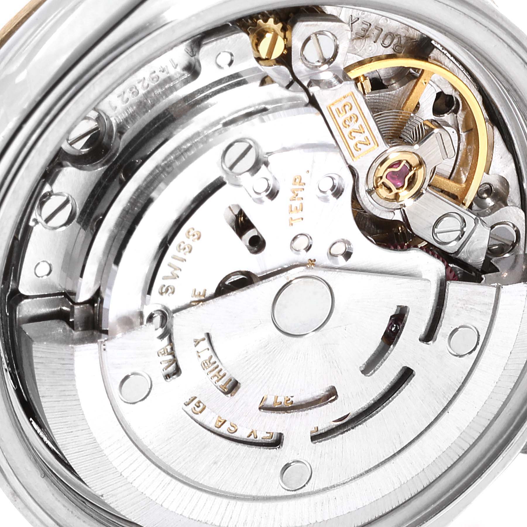 This close-up image shows the inner mechanical movement of a Rolex Datejust 79173 Women
s Steel and Gold (two tone) Mother of Pearl Dial 79173 Women
s Steel and Gold (two tone) Mother of Pearl Dial watch, highlighting gears and components.