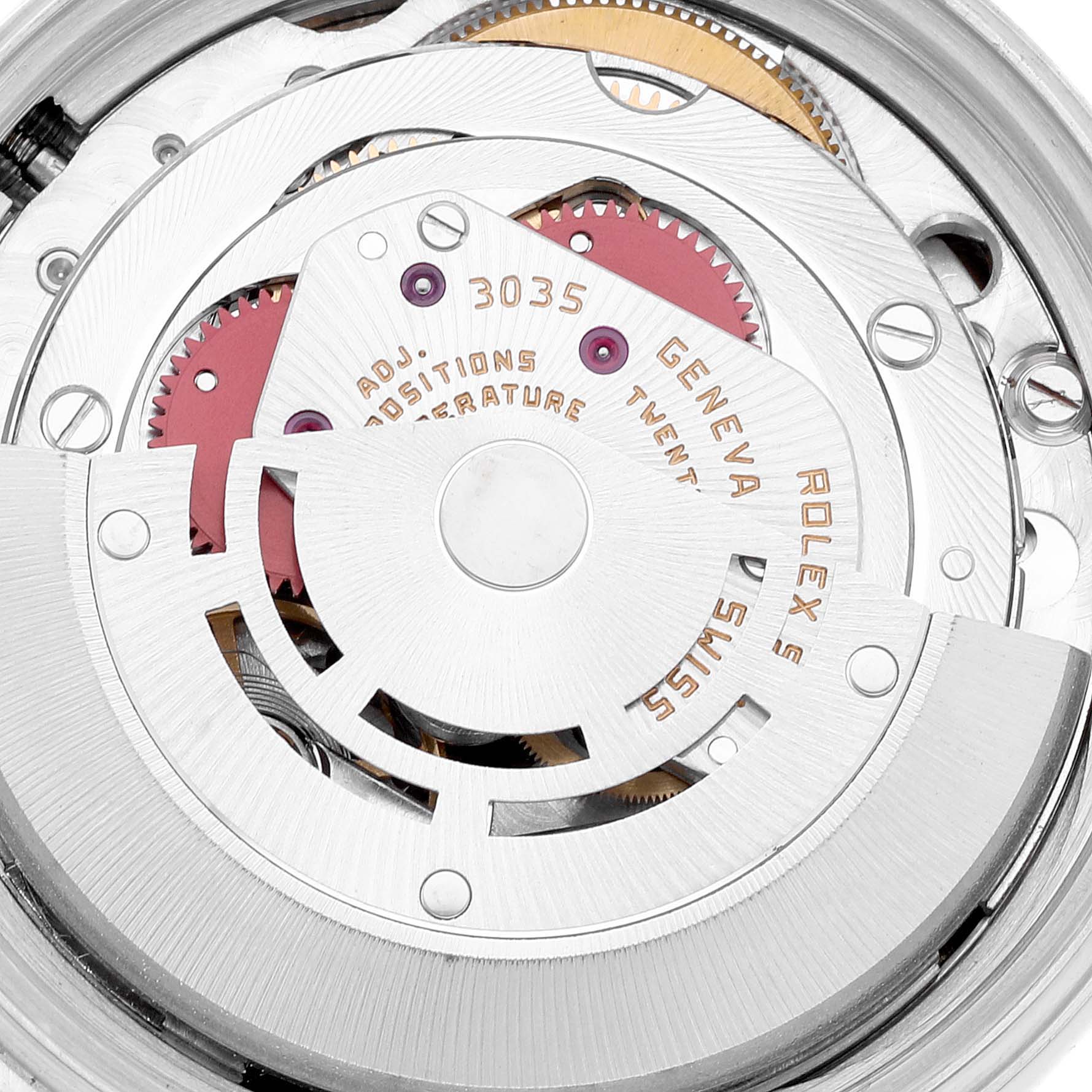 This is a close-up view of the movement inside a Rolex Datejust 16013 Men's Steel and Gold (two tone) Champagne Dial 16013 Men's Steel and Gold (two tone) Champagne Dial watch, showcasing its intricate gears and components.