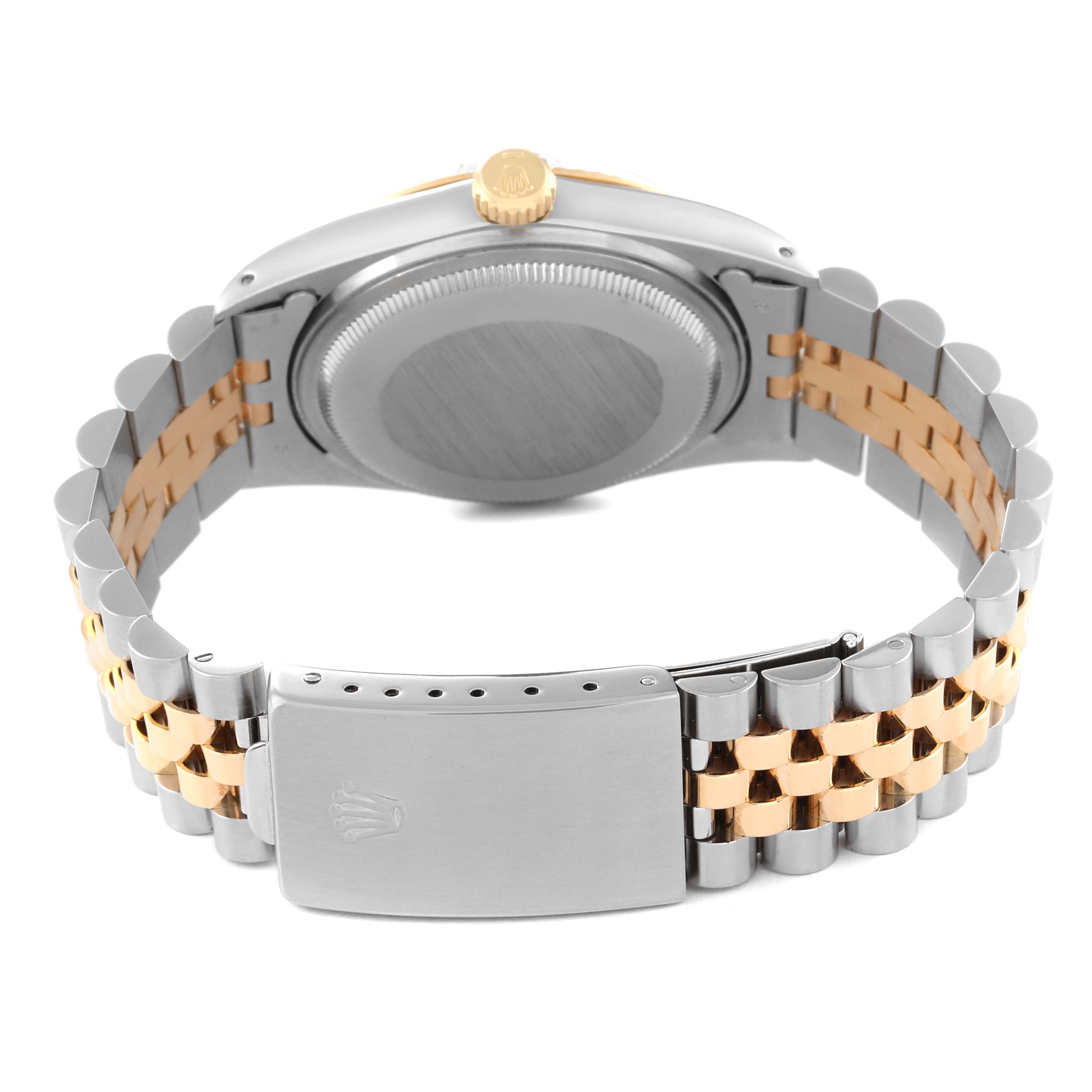 This image shows the back casing and bracelet of a Rolex Datejust 16013 Men's Steel and Gold (two tone) Champagne Dial 16013 Men's Steel and Gold (two tone) Champagne Dial watch, highlighting its two-tone metal links.