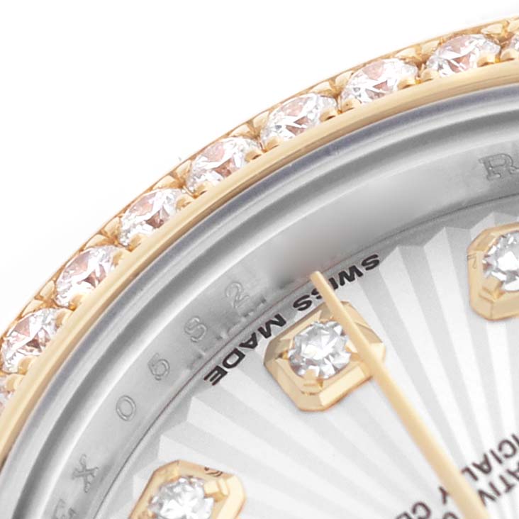 The image shows a close-up of the bezel and dial of a Rolex Datejust 179383 Women's Steel and Gold (two tone) Silver Dial, highlighting diamond hour markers and a diamond-set bezel.