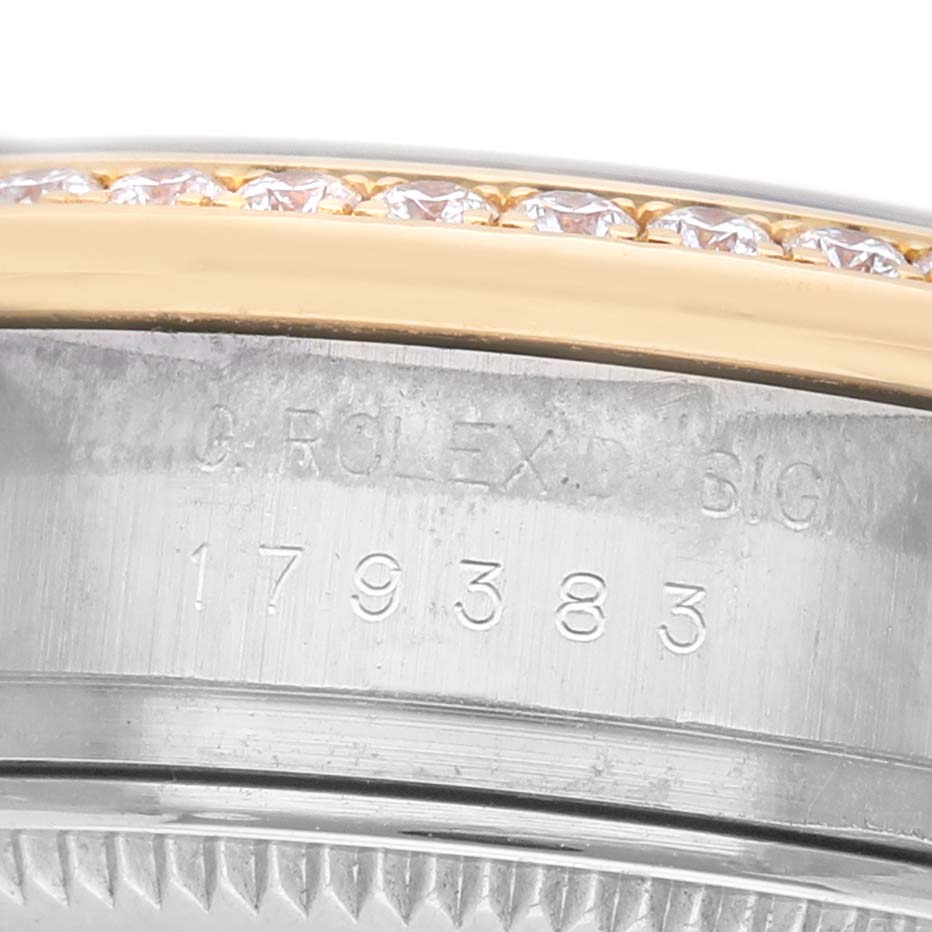 The image shows a close-up of the side of the Rolex Datejust 179383 Women's Steel and Gold (two tone) Silver Dial, highlighting the serial number and diamond-set bezel.