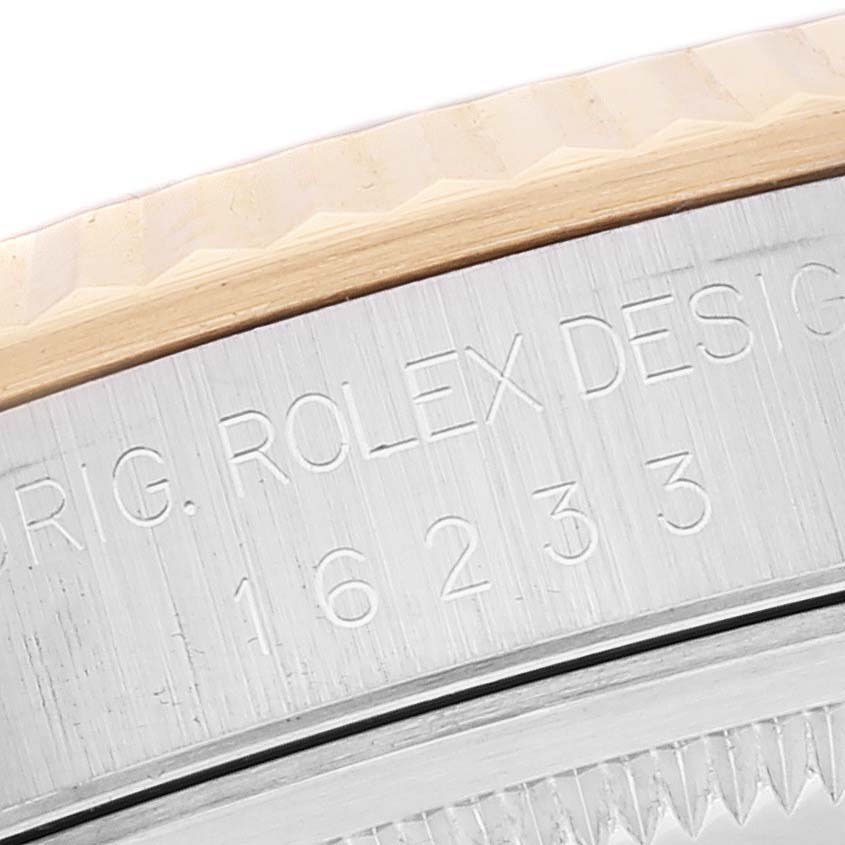 This image shows a close-up of the case and bezel of a Rolex Datejust 16233 Men's Steel and Gold (two tone) White Dial 16233 Men's Steel and Gold (two tone) White Dial watch, highlighting the model and brand engravings.