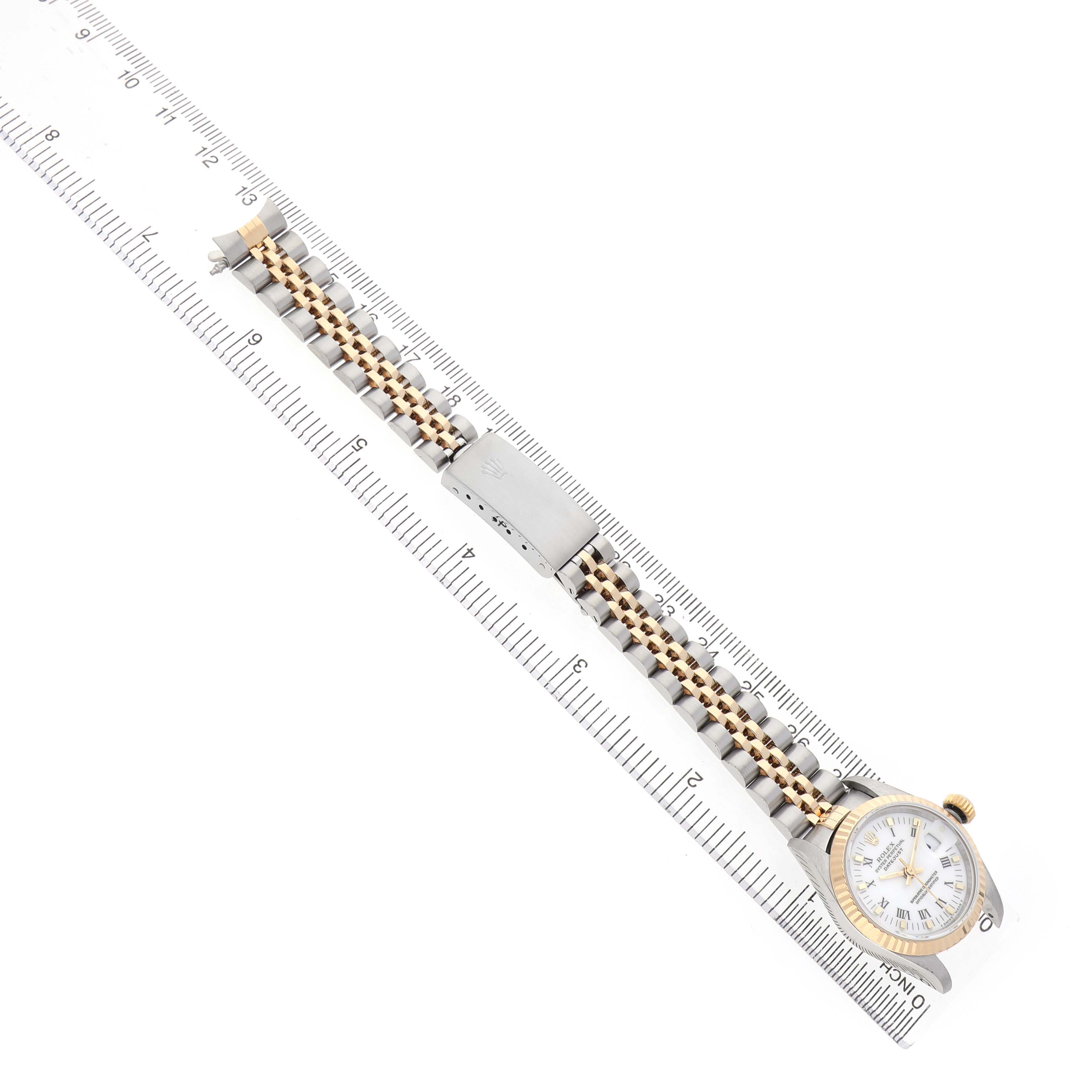 The Rolex Datejust 69173 Women's Steel and Gold (two tone) White Dial watch is shown from a top view, highlighting the watch face, two-tone bracelet, and clasp.