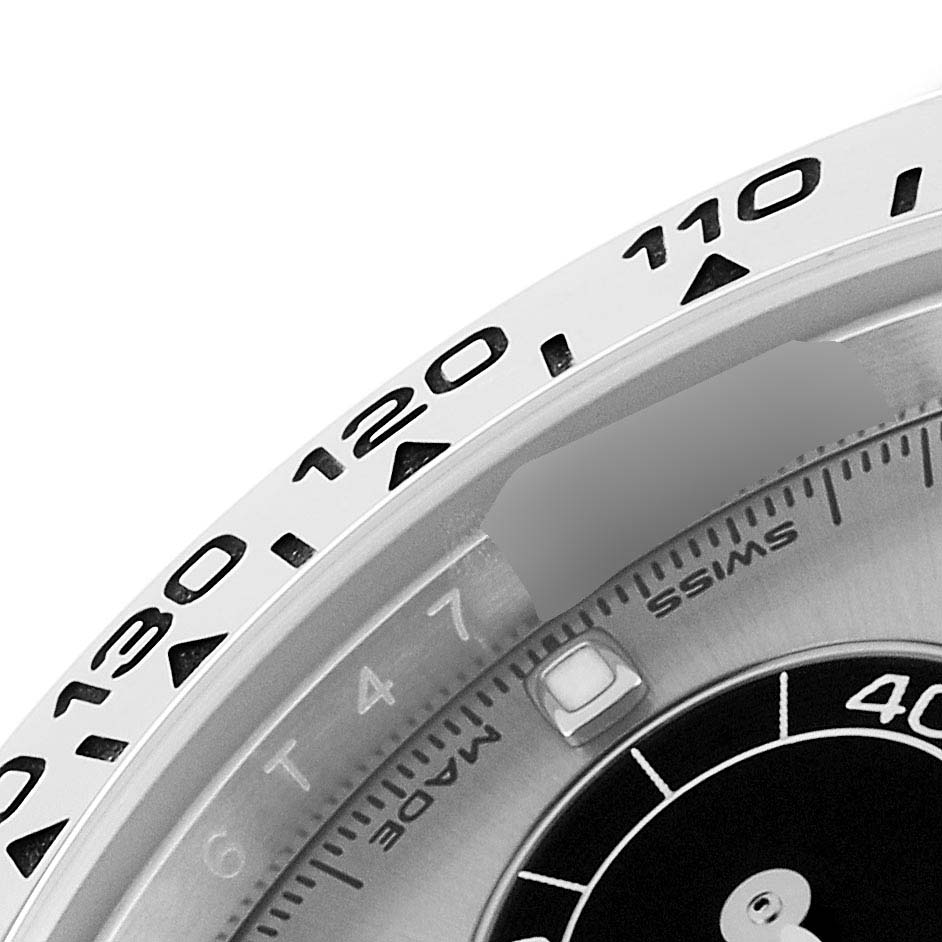 The image shows a close-up of the bezel, dial, and part of the tachymeter scale of the Rolex Daytona 116509 Men's White Gold Silver Dial 116509 Men's White Gold Silver Dial watch.
