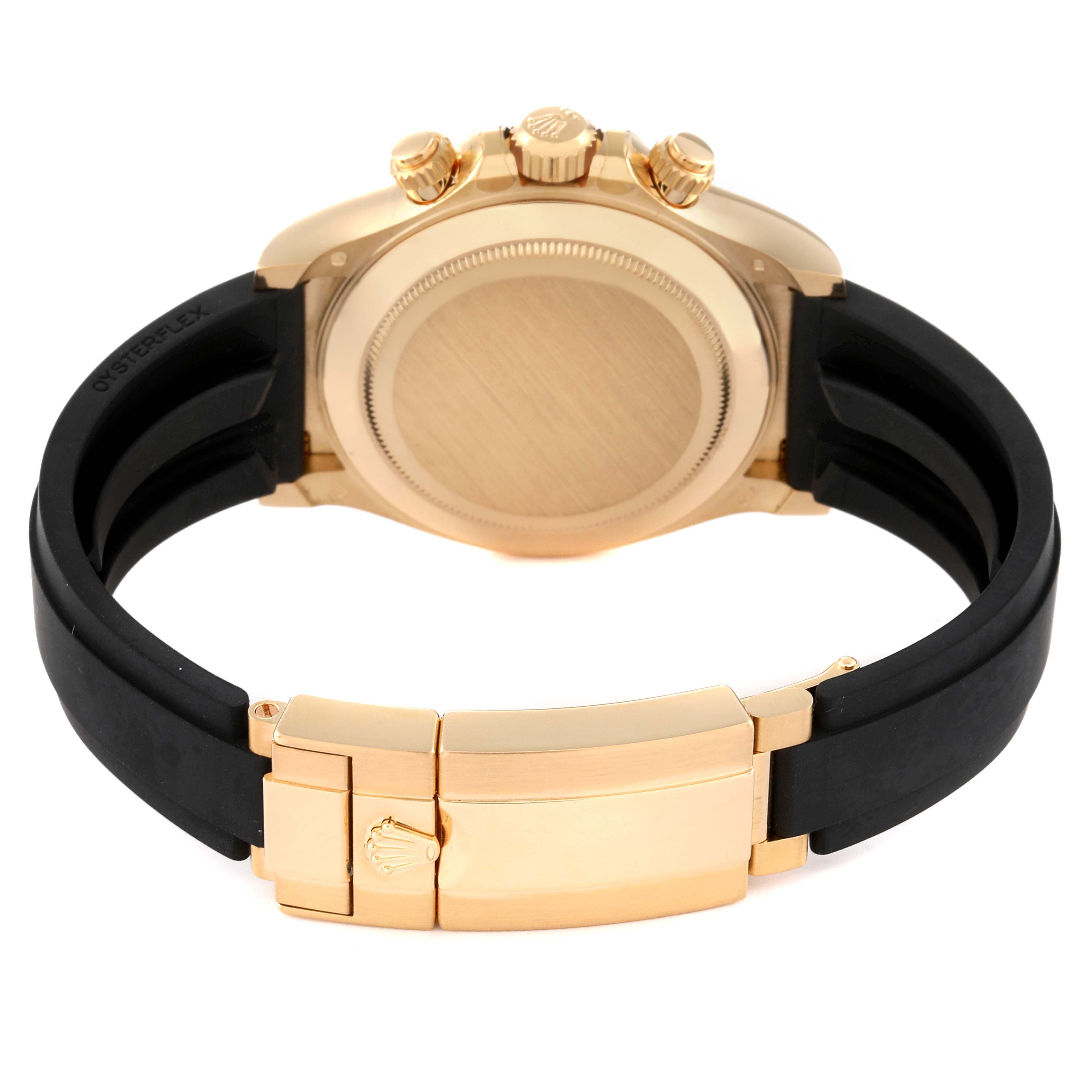 This image shows the back of a Rolex Daytona 116518 Men's Yellow Gold White Dial 116518 Men's Yellow Gold White Dial watch, highlighting its gold case back, crown, pushers, and black Oysterflex strap with clasp.