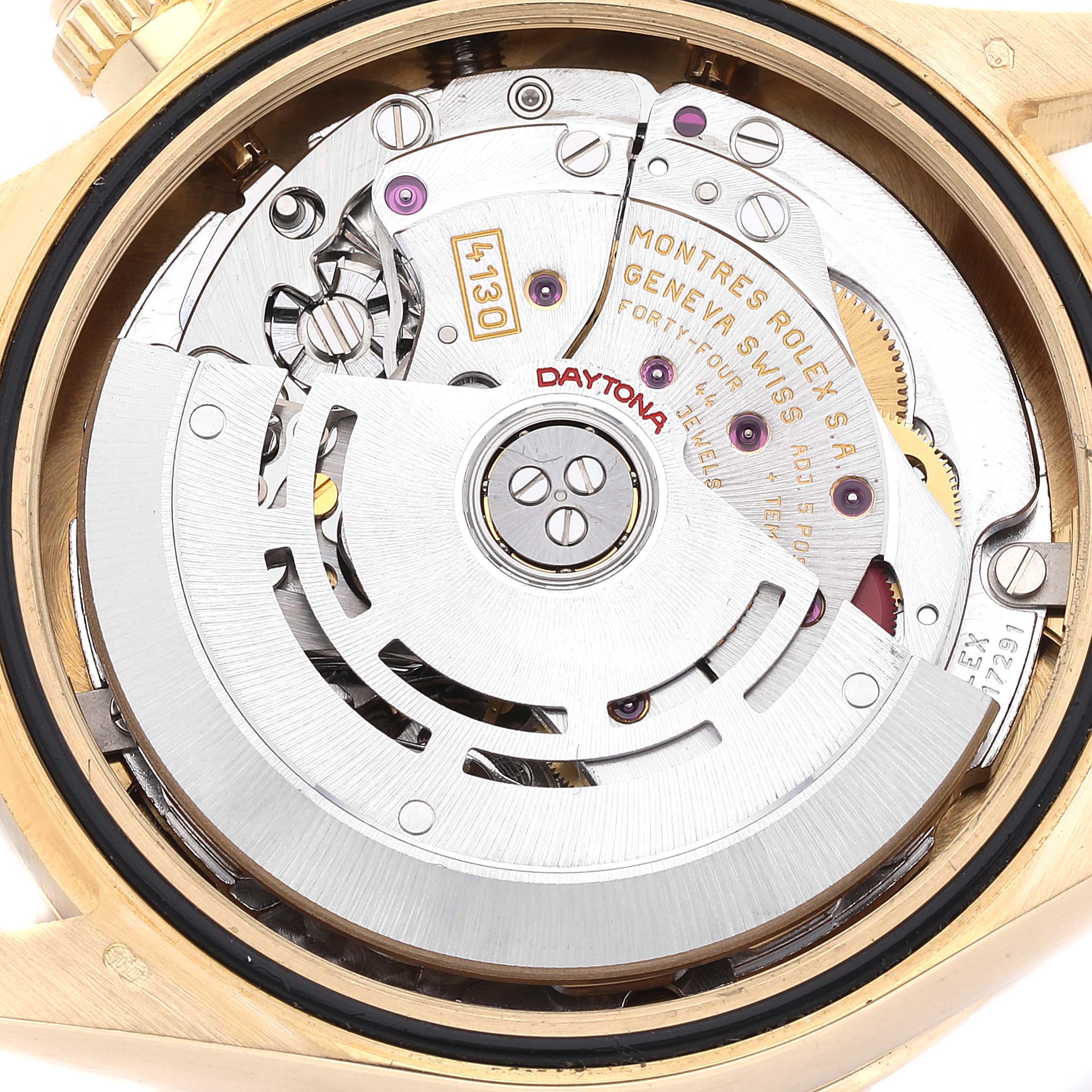 Close-up view of the movement inside a Rolex Daytona 116528 Men's Yellow Gold Champagne Dial 116528 Men's Yellow Gold Champagne Dial watch, showing gears and the rotor.