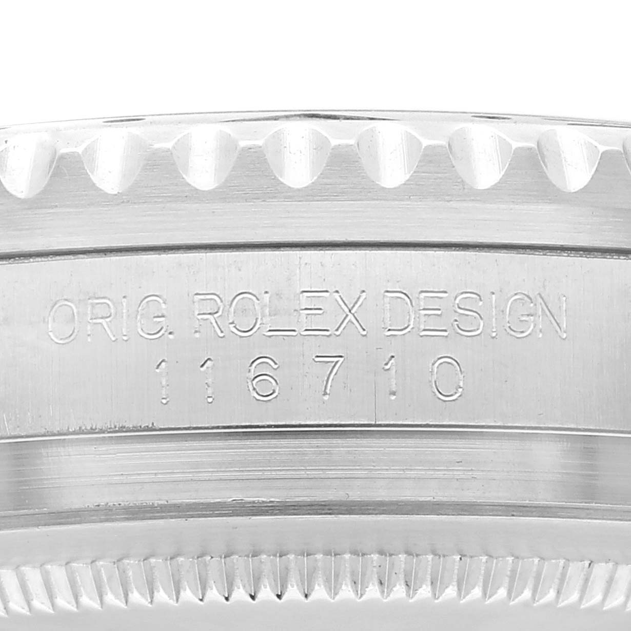 The image shows a close-up of the edge and case of a Rolex GMT-Master 116710 Men
s Stainless Steel Black Dial 116710 Men
s Stainless Steel Black Dial model, with the text "ORIG. ROLEX DESIGN 116710" engraved.