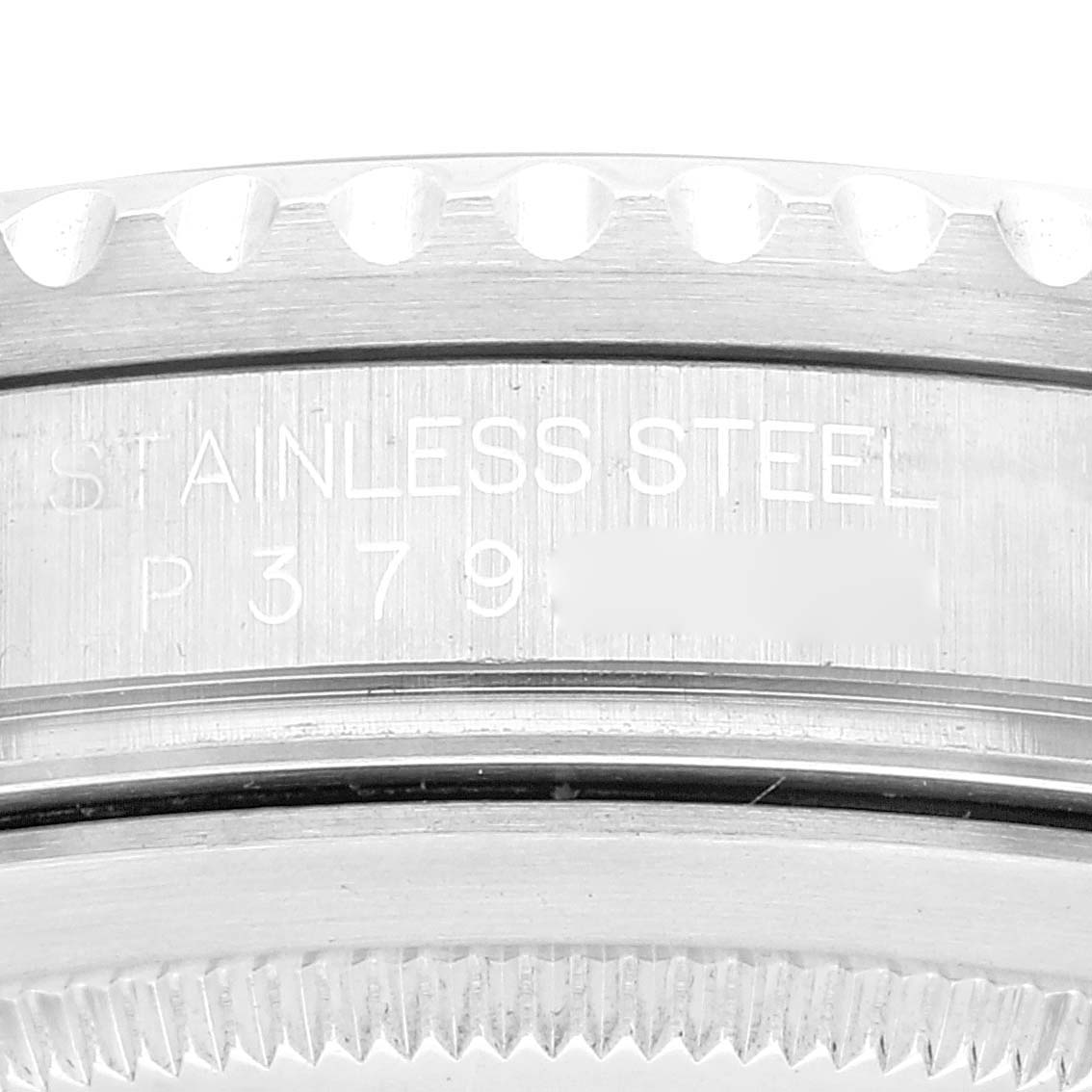 The image shows a close-up of the engraved serial number and material on the stainless steel case of a Rolex GMT-Master 16710 Men
s Stainless Steel Black Dial 16710 Men
s Stainless Steel Black Dial watch.