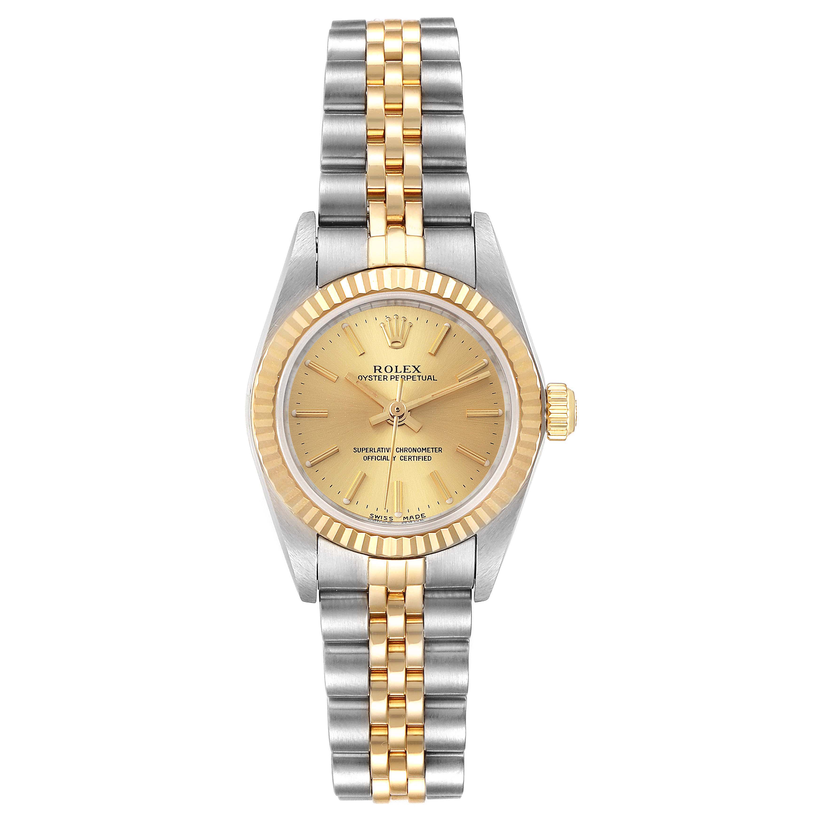 This image shows a Rolex Oyster Perpetual 76193 Women
s Steel and Gold (two tone) Champagne Dial 76193 Women
s Steel and Gold (two tone) Champagne Dial watch from a top-down angle, highlighting its gold dial, fluted bezel, and two-tone bracelet.