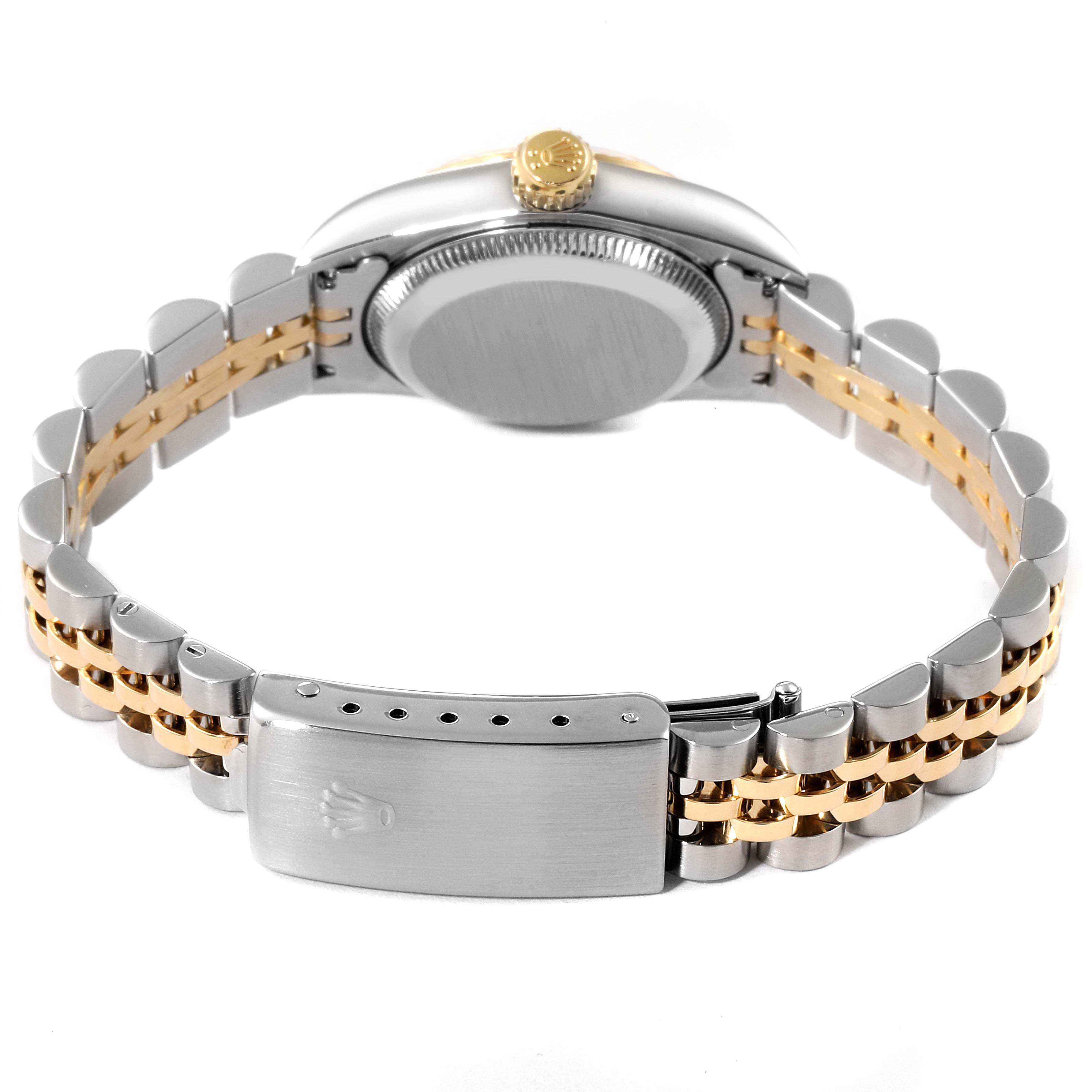 The image shows the back view, crown, and clasp band of a Rolex Oyster Perpetual 76193 Women
s Steel and Gold (two tone) Champagne Dial 76193 Women
s Steel and Gold (two tone) Champagne Dial watch.