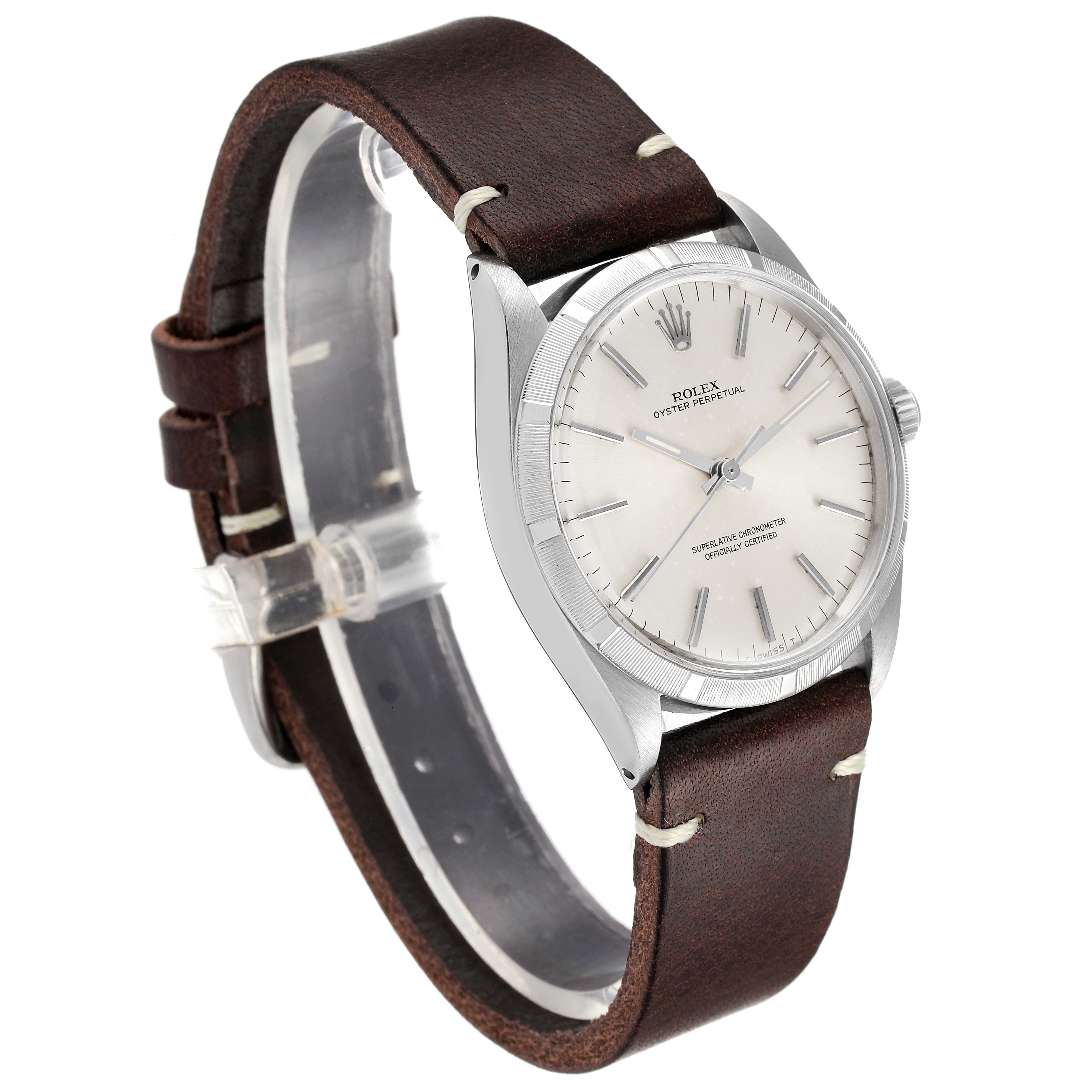 The Rolex Vintage Collection 1003 Men
s Stainless Steel Silver Dial 1003 Men
s Stainless Steel Silver Dial watch is shown at a slight angle, displaying the face, bezel, case, and leather strap.