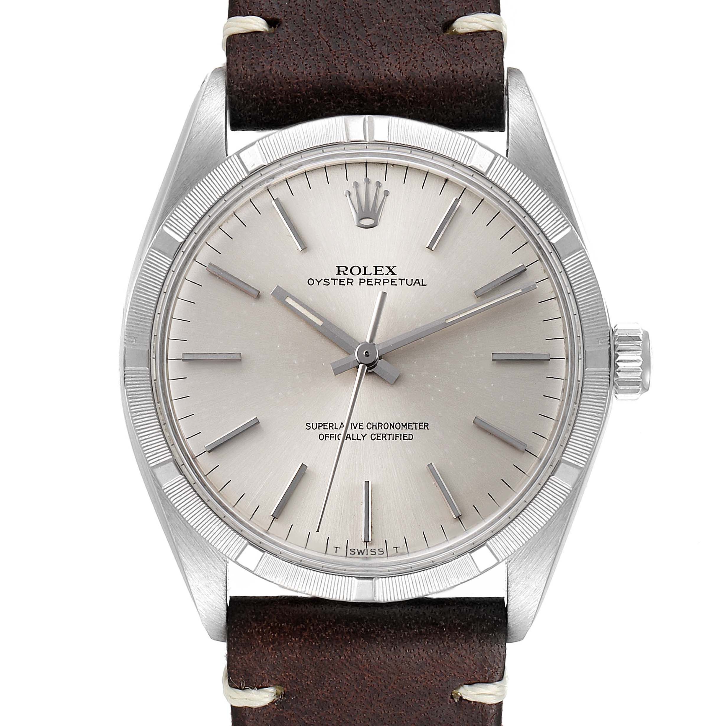 The image shows a frontal view of the Rolex Vintage Collection 1003 Men
s Stainless Steel Silver Dial 1003 Men
s Stainless Steel Silver Dial Oyster Perpetual watch, highlighting its dial, hands, and leather strap.
