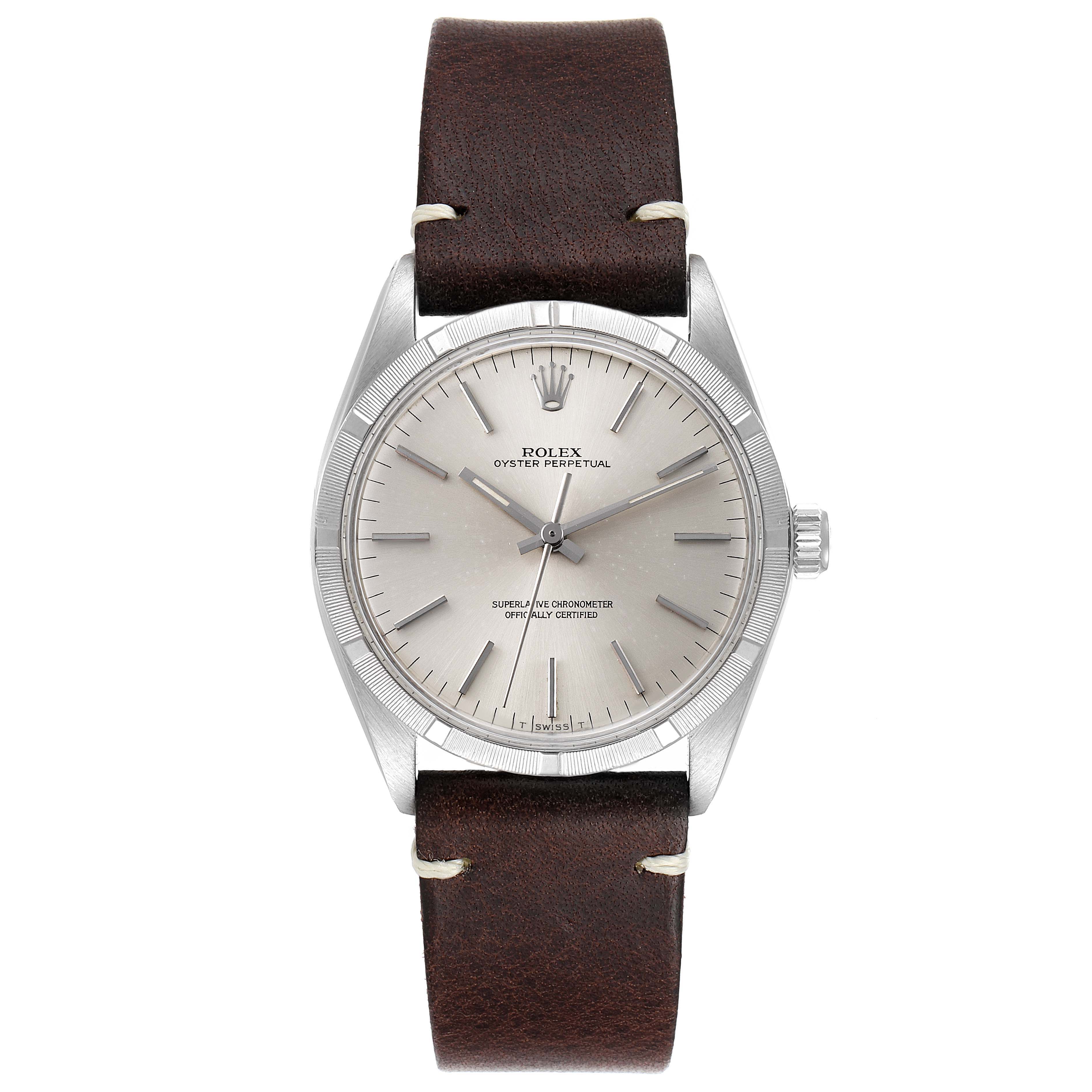 This image shows a front view of a Rolex Vintage Collection 1003 Men
s Stainless Steel Silver Dial 1003 Men
s Stainless Steel Silver Dial watch with a brown leather strap and a silver dial.