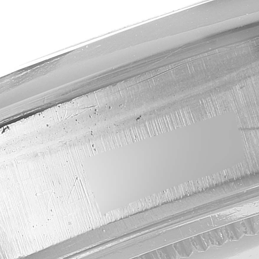 This image shows a close-up of the inner side of the case or bezel of the Rolex Vintage Collection 6694 Men
s Stainless Steel Silver Dial 6694 Men
s Stainless Steel Silver Dial watch, focusing on the engraved details.