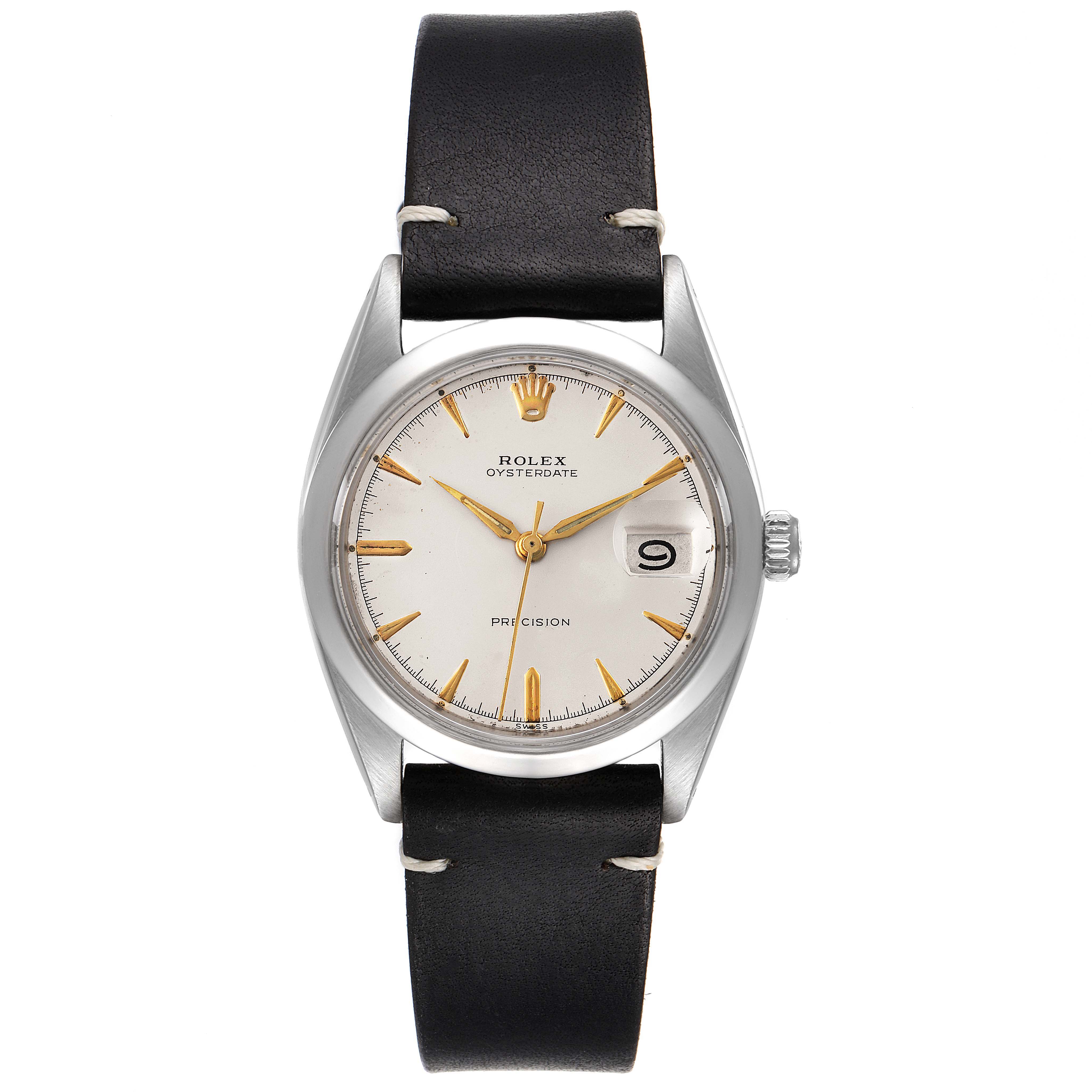The image shows a front view of a Rolex Vintage Collection 6694 Men
s Stainless Steel Silver Dial 6694 Men
s Stainless Steel Silver Dial Oysterdate model with a black leather strap and gold details.
