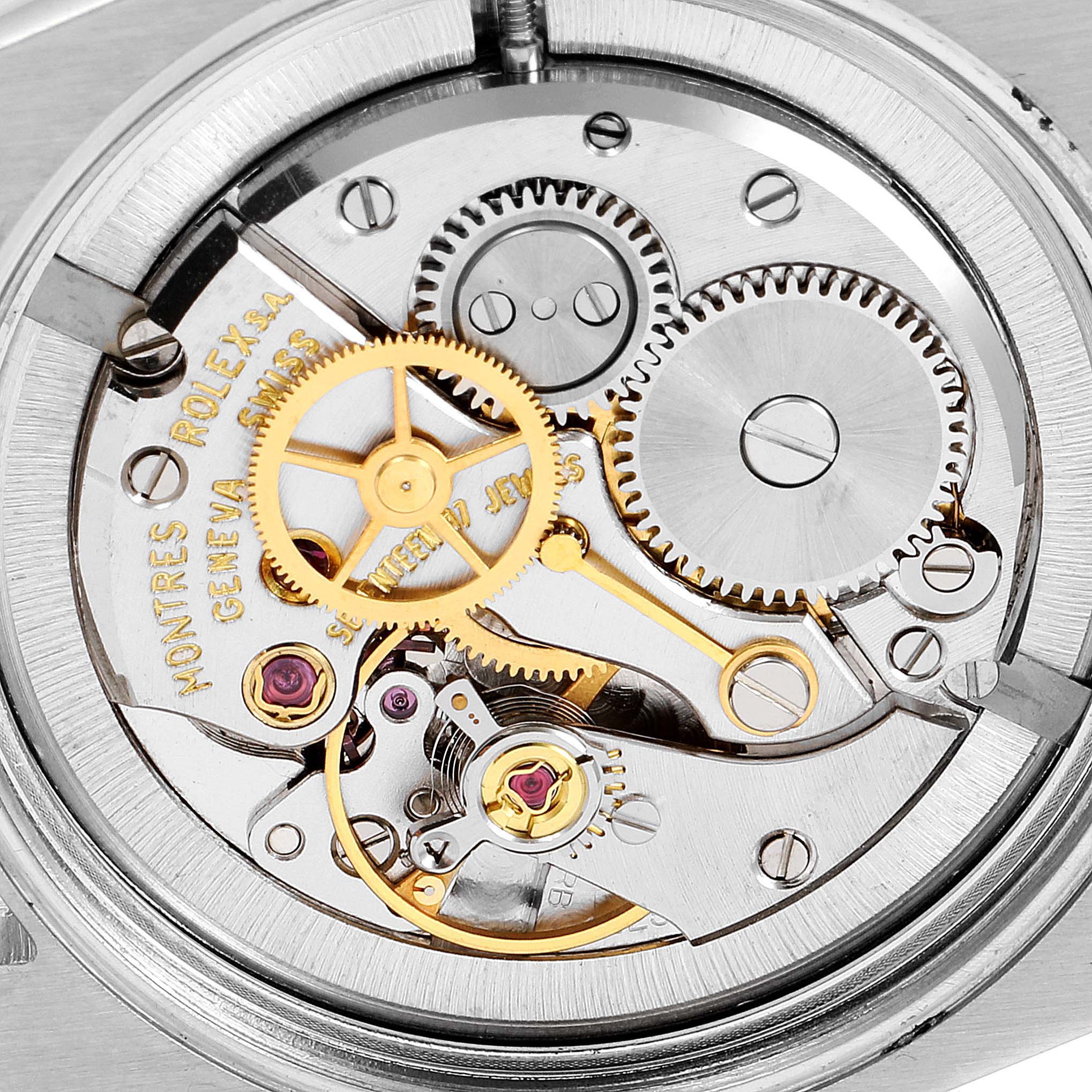 This image shows a close-up of the intricate inner mechanical components of a Vintage Collection Rolex watch.