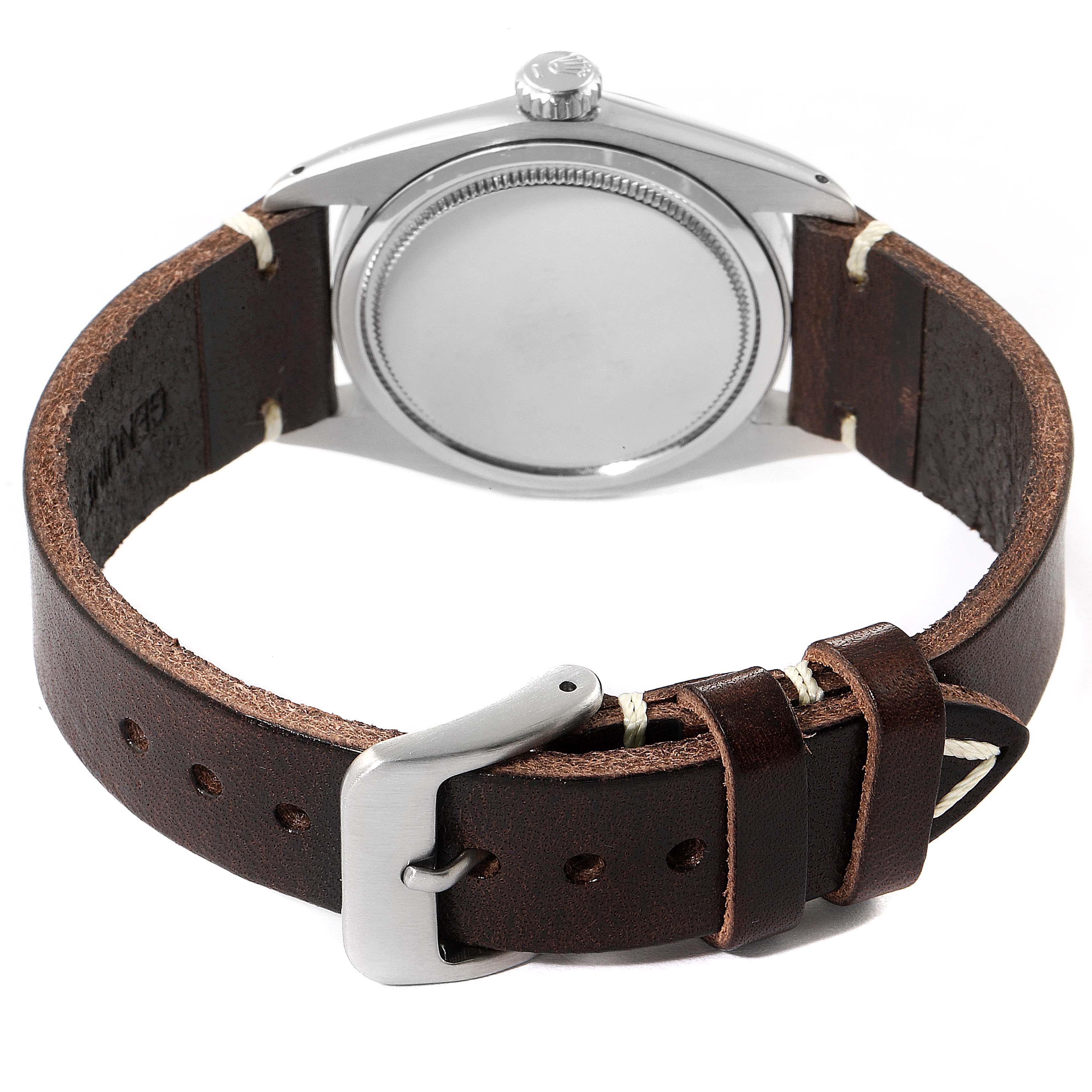 The image shows the back and side view of a Rolex Vintage Collection 6426 Men's Stainless Steel Silver Dial 6426 Men's Stainless Steel Silver Dial watch with a brown leather strap and metal clasp.