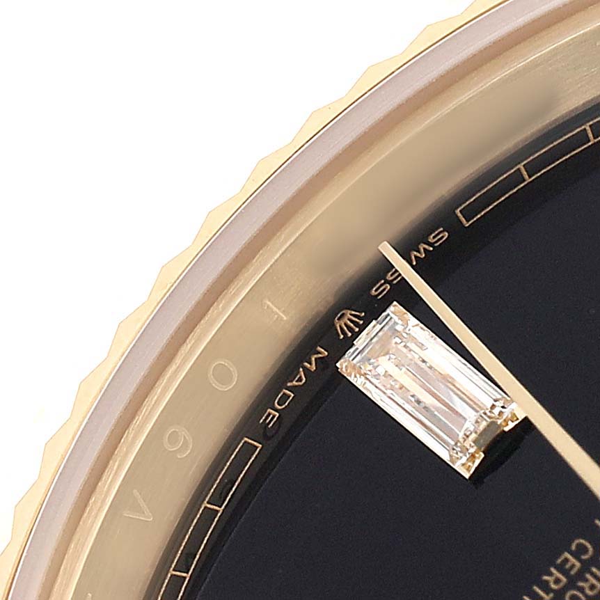 The image shows a close-up of a Rolex President 228238 Men's Yellow Gold Black Dial model watch dial, highlighting a diamond marker and part of the bezel.
