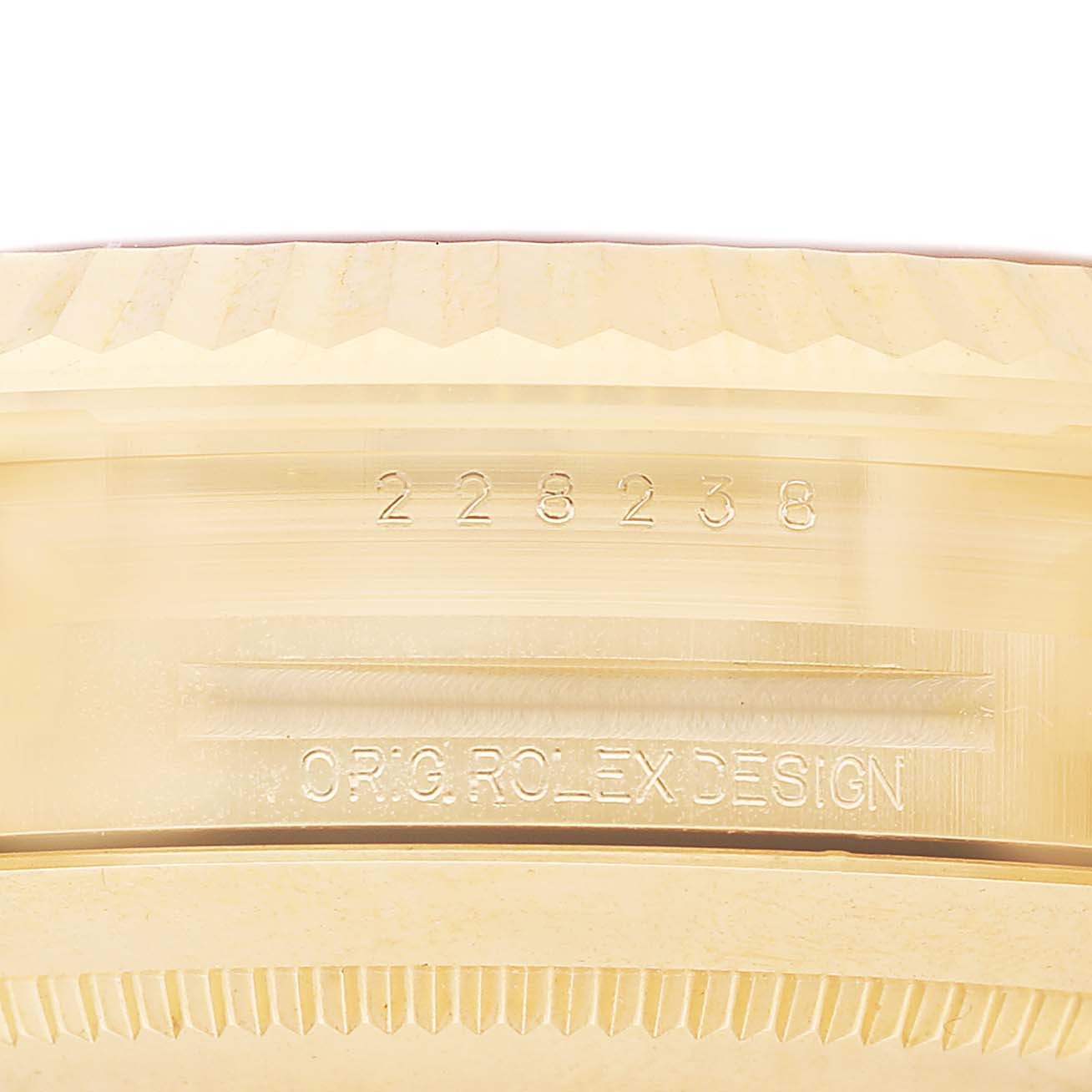 The image shows the side profile of a Rolex President 228238 Men's Yellow Gold Black Dial model, focusing on the case with visible engravings.