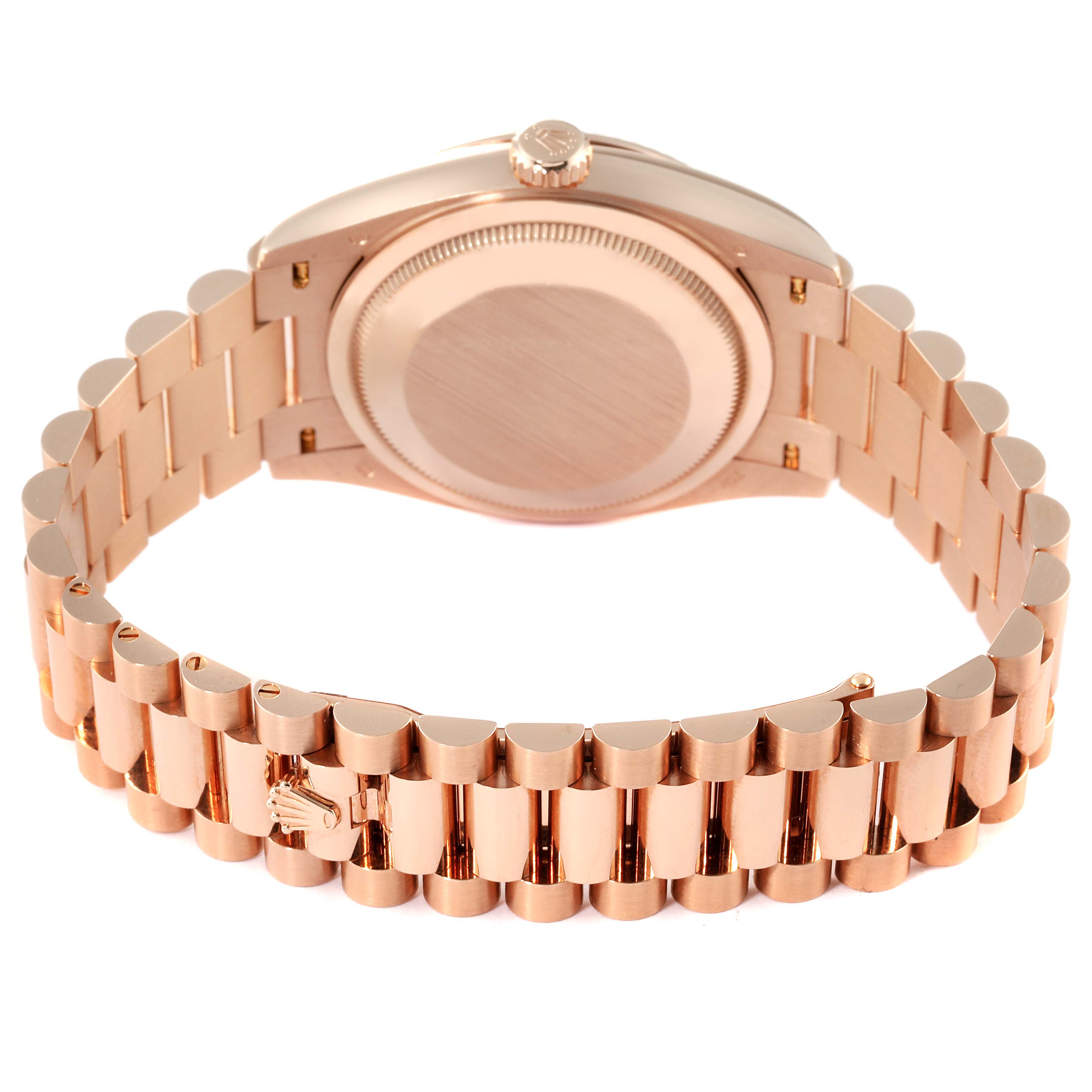 The image shows the back and bracelet of a Rolex President 128235 Men's Rose Gold Mother of Pearl Dial 128235 Men's Rose Gold Mother of Pearl Dial model watch at a slight downward angle.