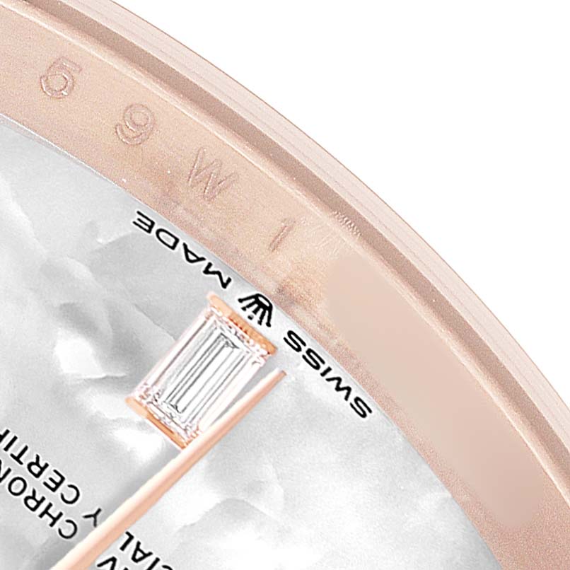 The image shows a close-up of the dial edge and case of a Rolex President 128235 Men's Rose Gold Mother of Pearl Dial watch, highlighting the "Swiss Made" label and an hour marker.