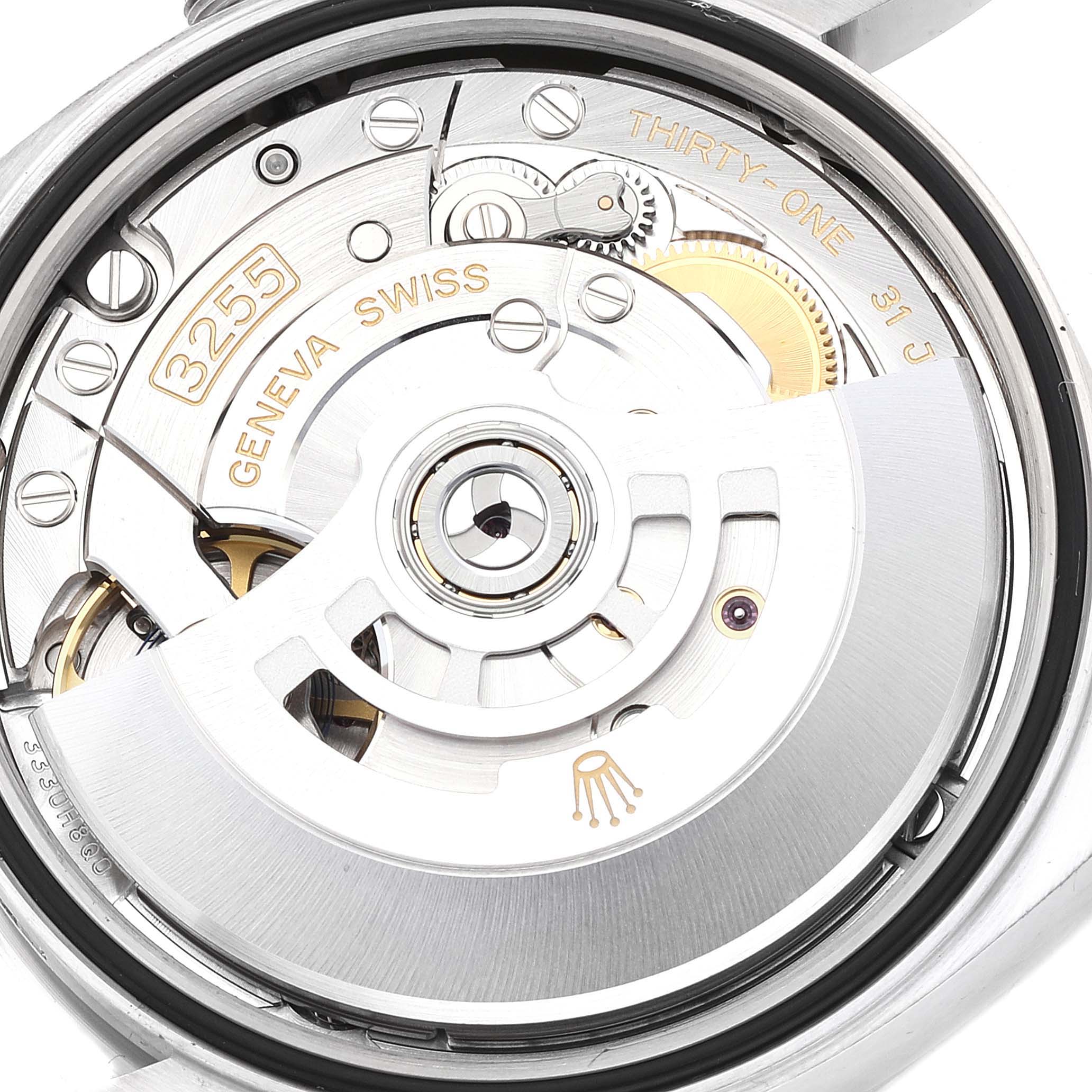 The image shows a close-up of the Rolex President 128239 Men's White Gold Blue Dial 128239 Men's White Gold Blue Dial model's internal movement, highlighting the intricate gears and components.